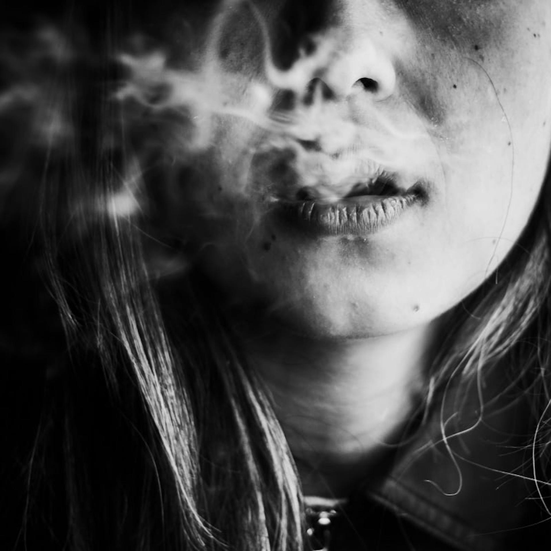 A young woman smoking meth.