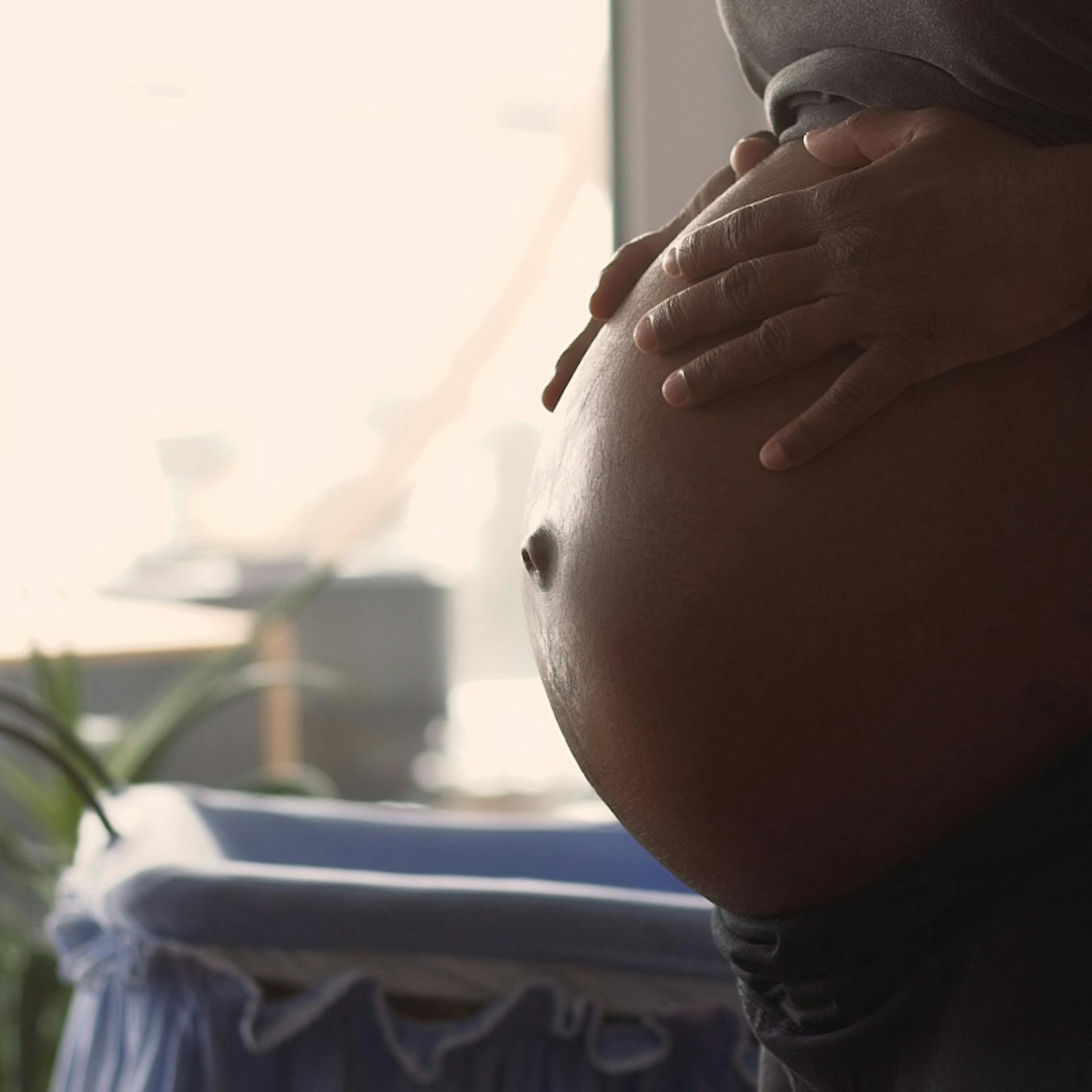 A woman worries about finding a midwife as she nears the end of her pregnancy.