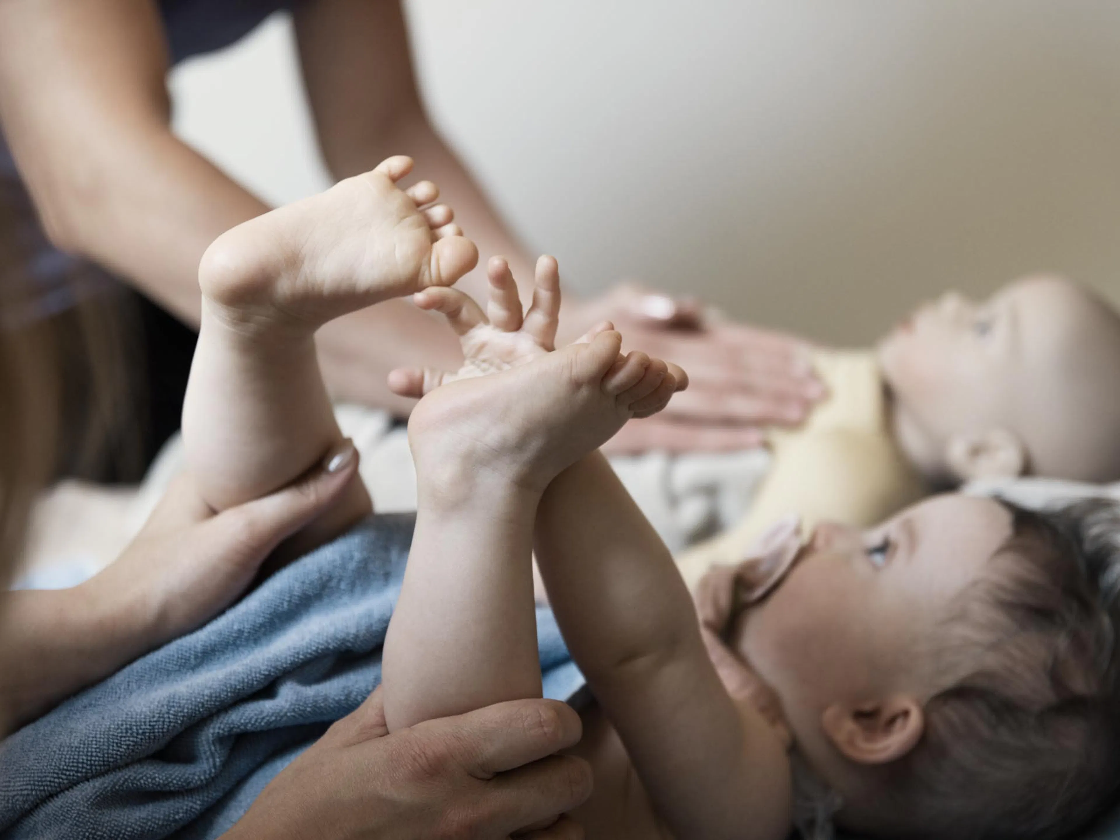 Baby massage in a treatment room at a Familux Resort.