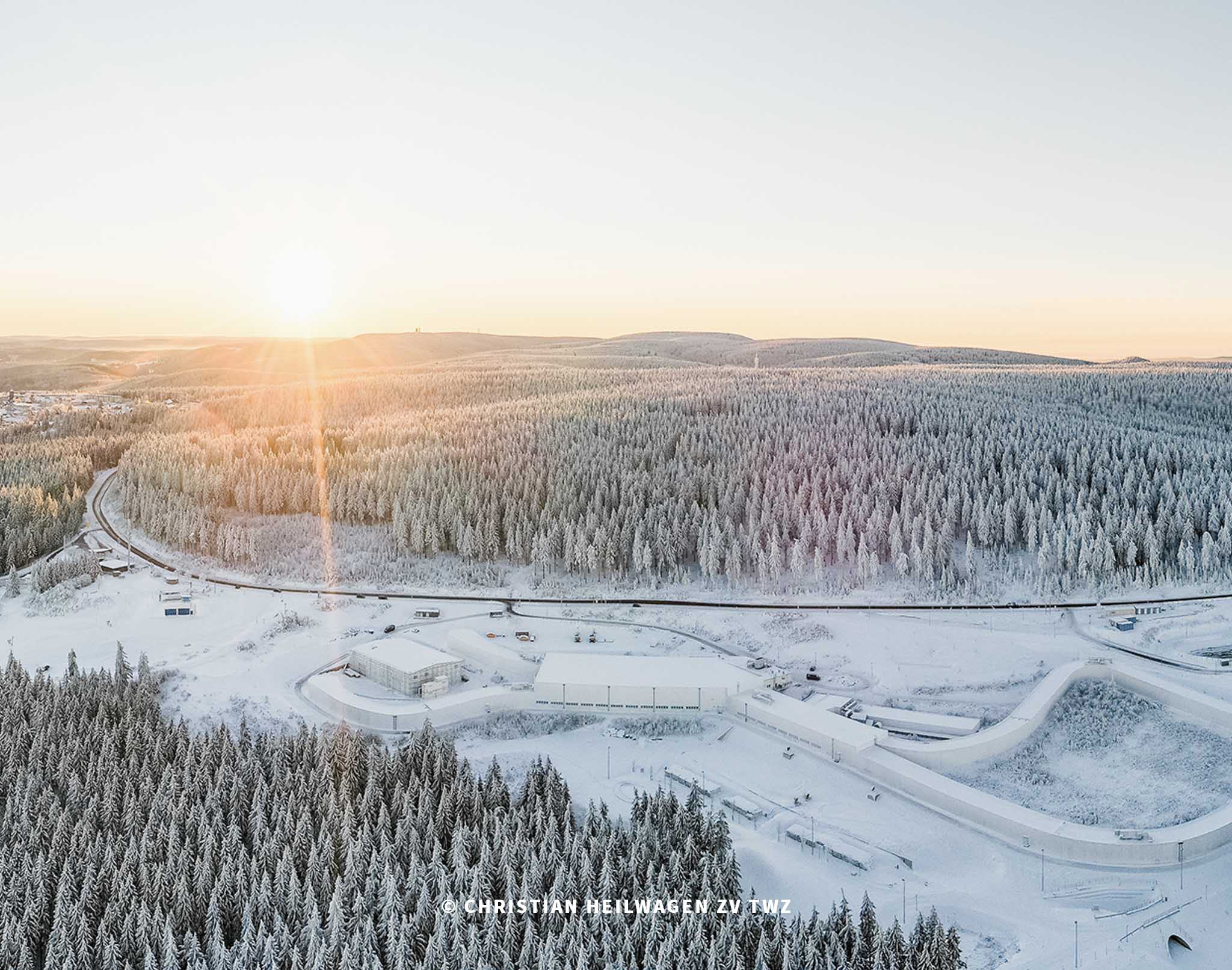 Aerial view of the Thuringian Forest with snow and cross-country skiing trails.