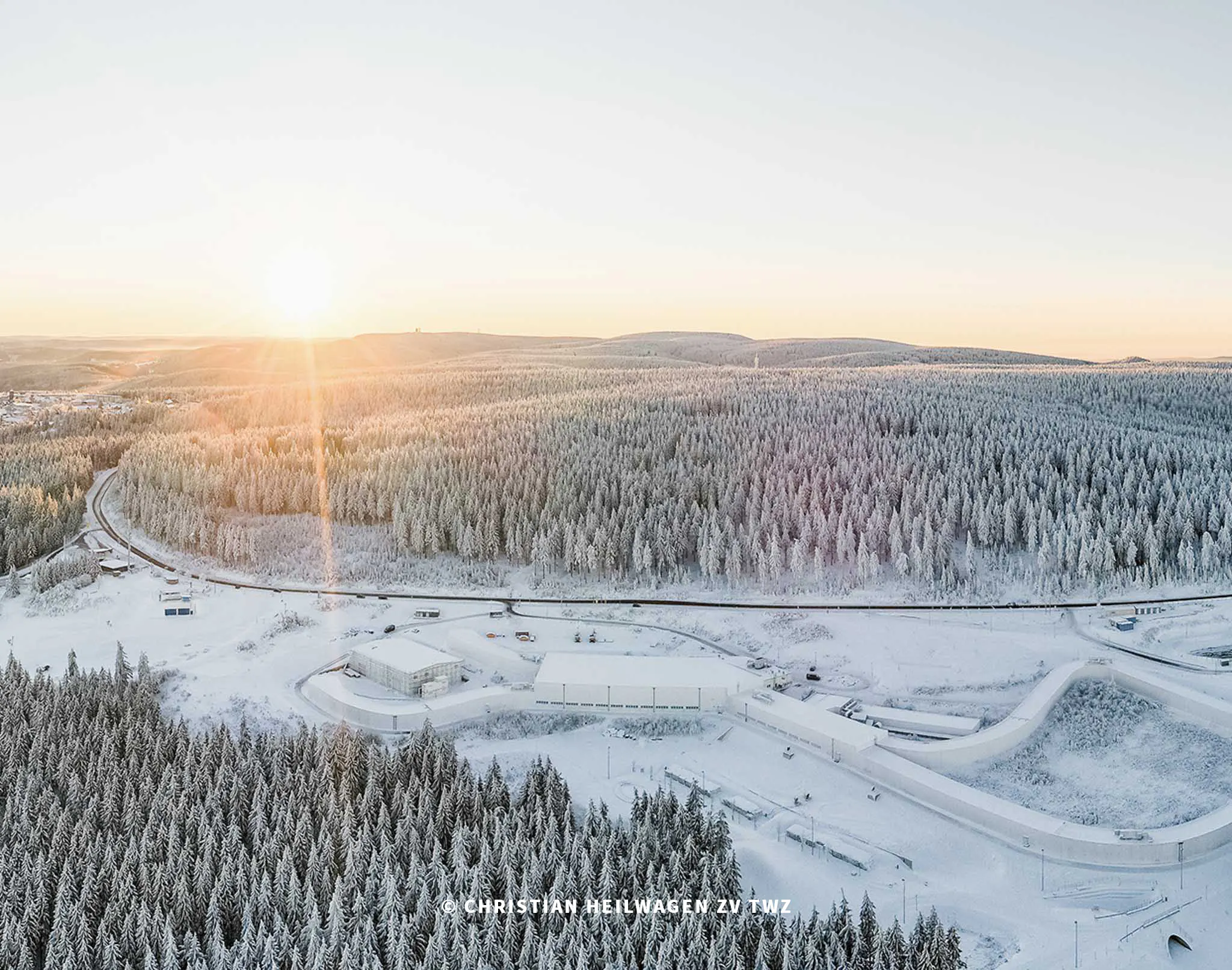 Aerial view of the Thuringian Forest with snow and cross-country skiing trails.