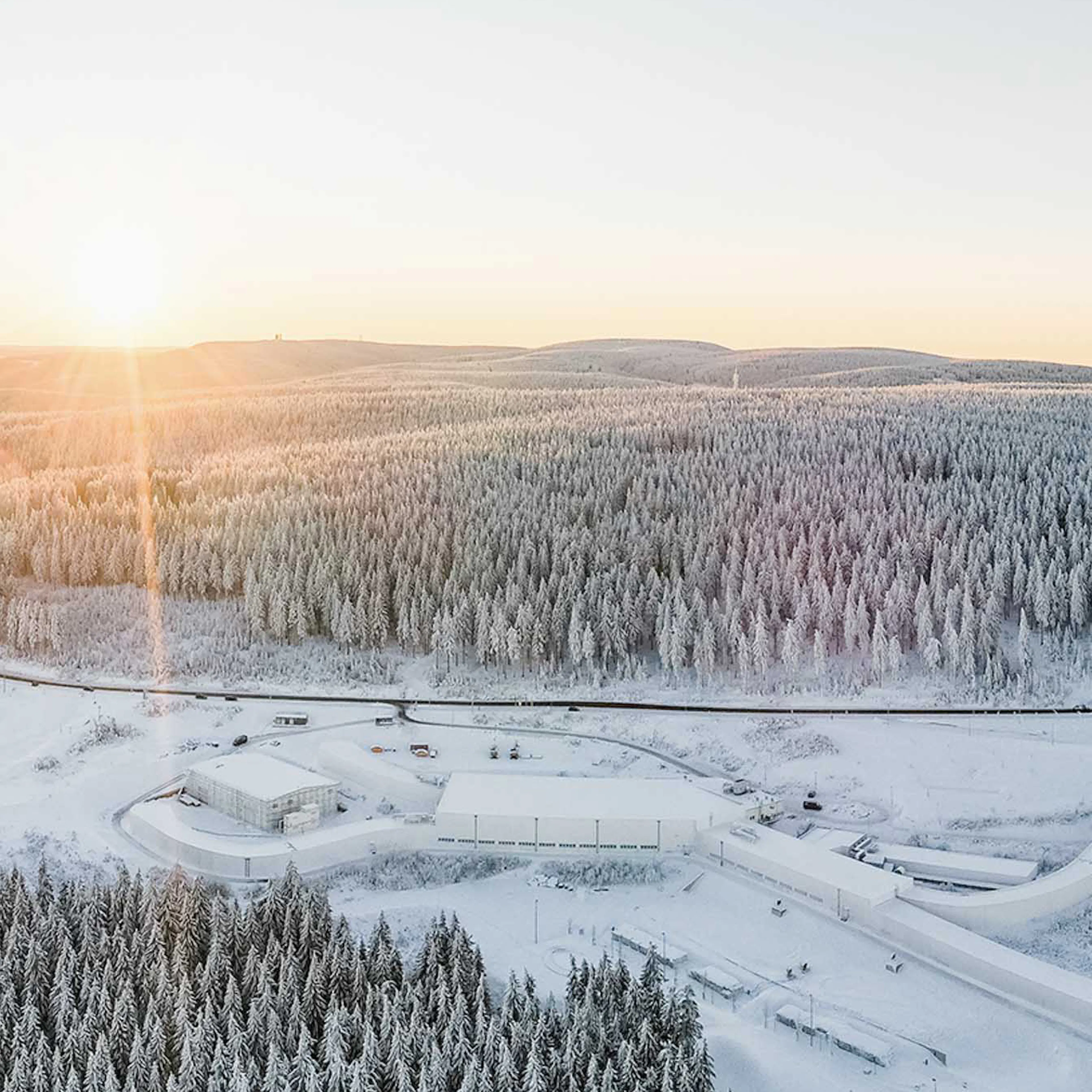 Aerial view of the Thuringian Forest with snow and cross-country skiing trails.