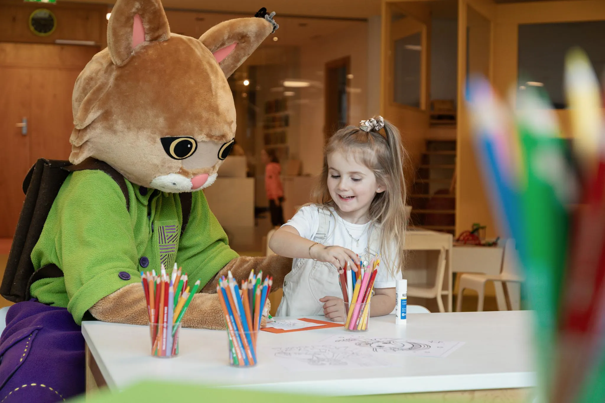 Girl doing crafts in the Kids Club of a Familux Resort with Lila Lux.