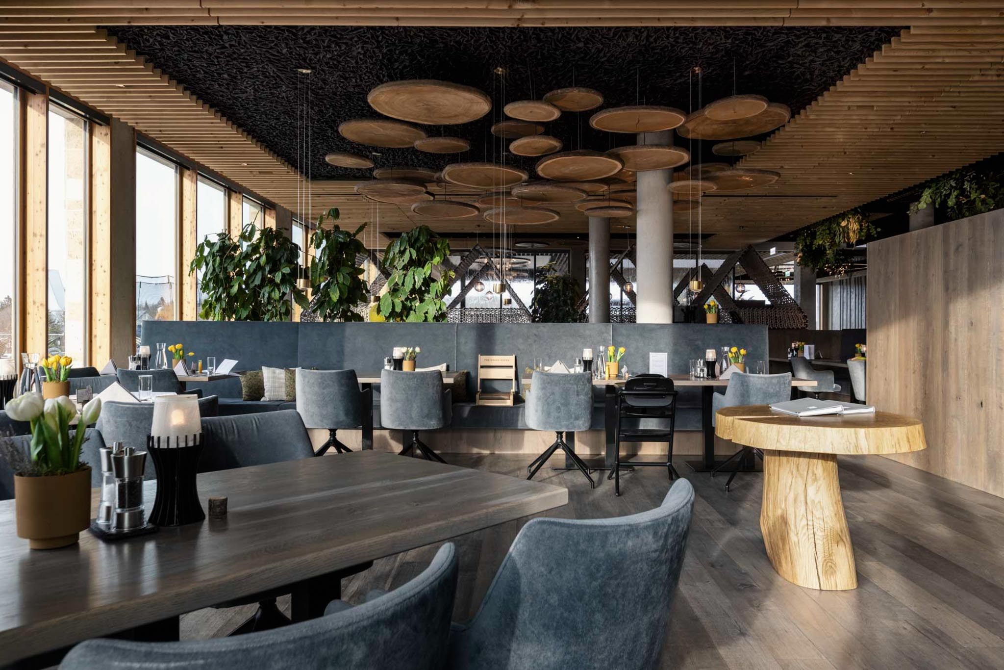 Restaurant with chairs and tables at The Grand Green – Familux Resort.