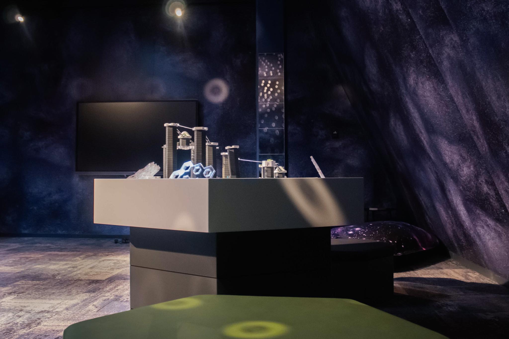 Space-themed teen club with games table at The Grand Green – Familux Resort.