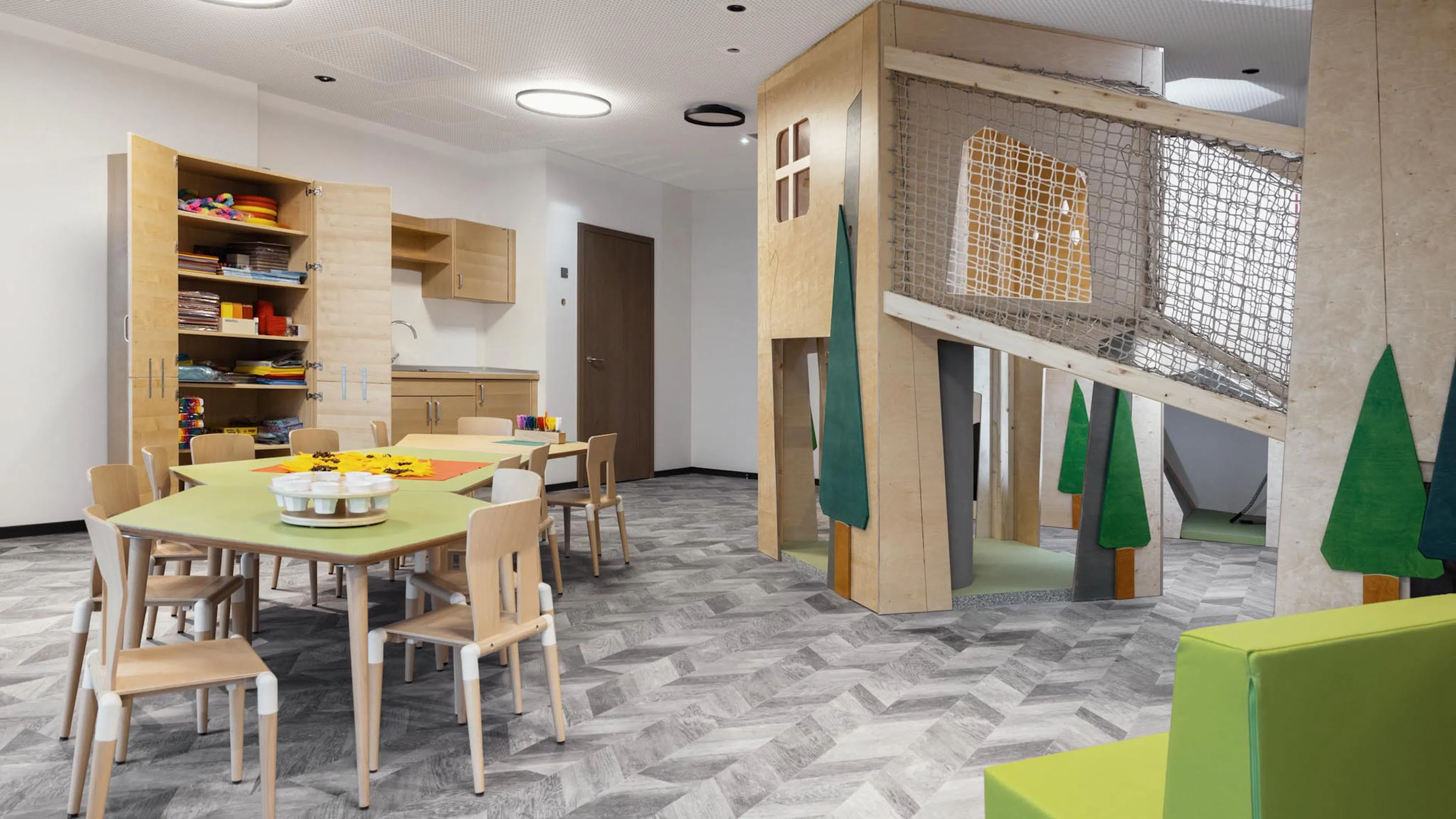 Mini Club with tables, chairs and arts and crafts supplies at The Grand Green – Familux Resort.