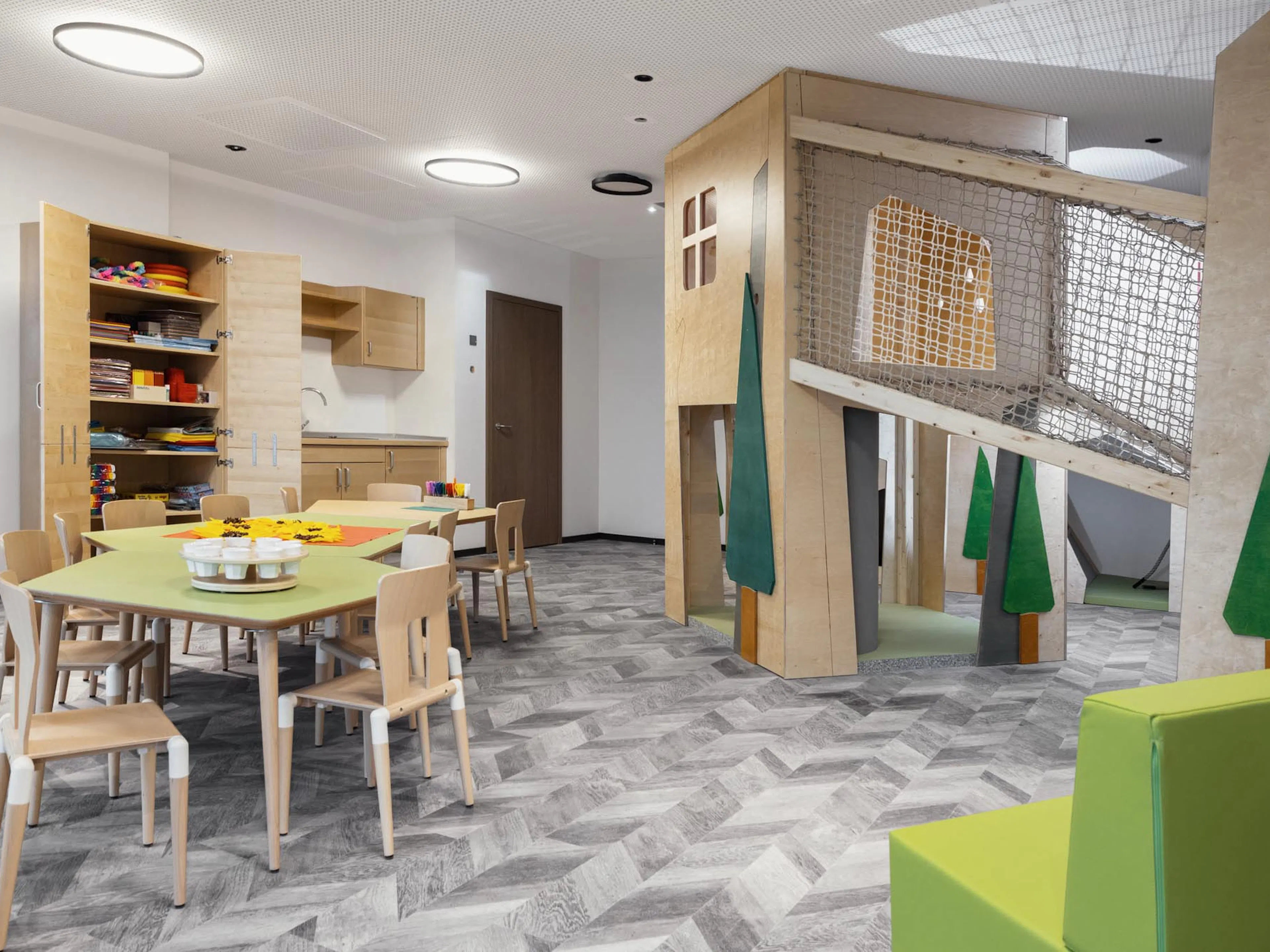 Mini Club with tables, chairs and arts and crafts supplies at The Grand Green – Familux Resort.