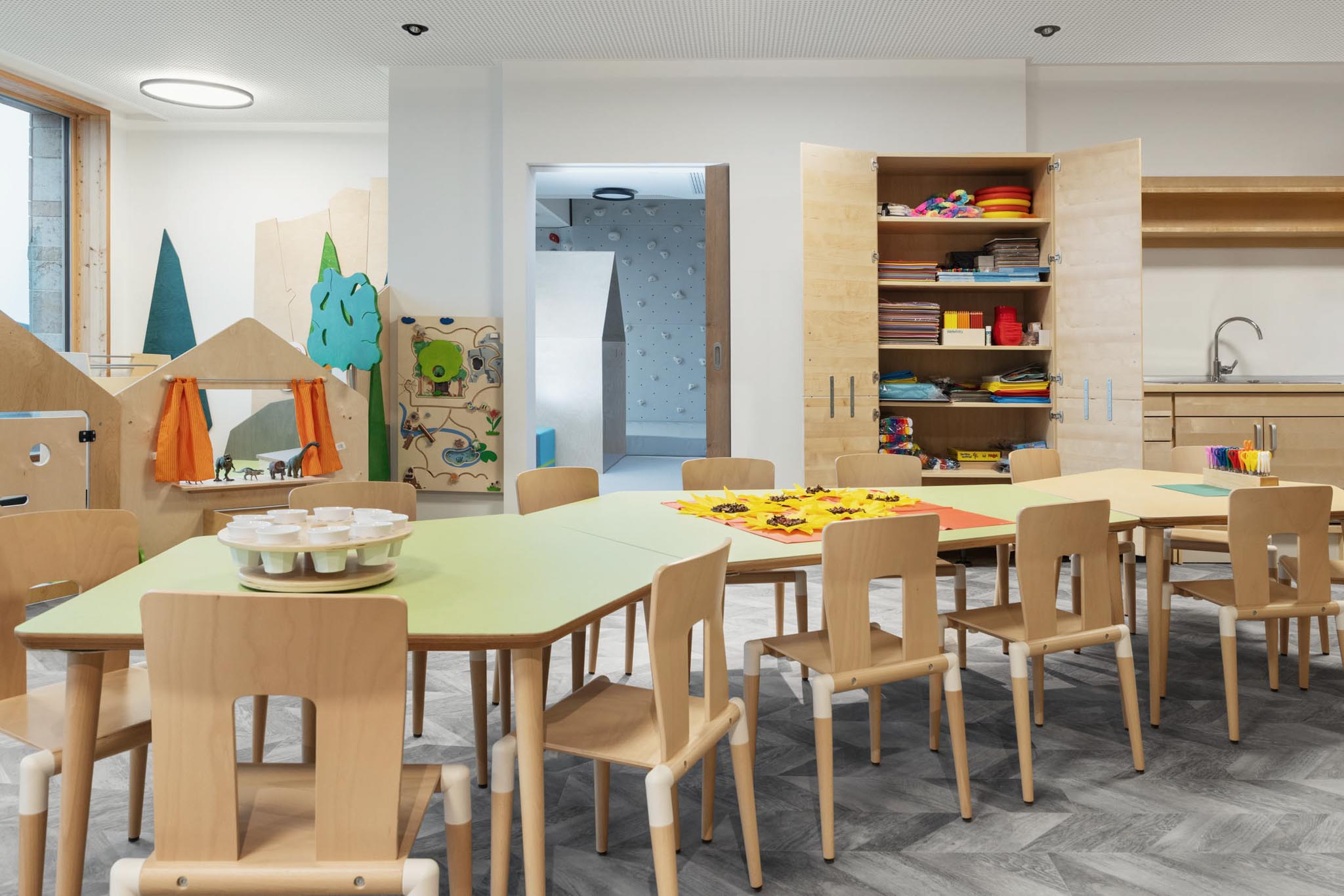 Mini Club with tables, chairs and arts and crafts supplies at The Grand Green – Familux Resort.