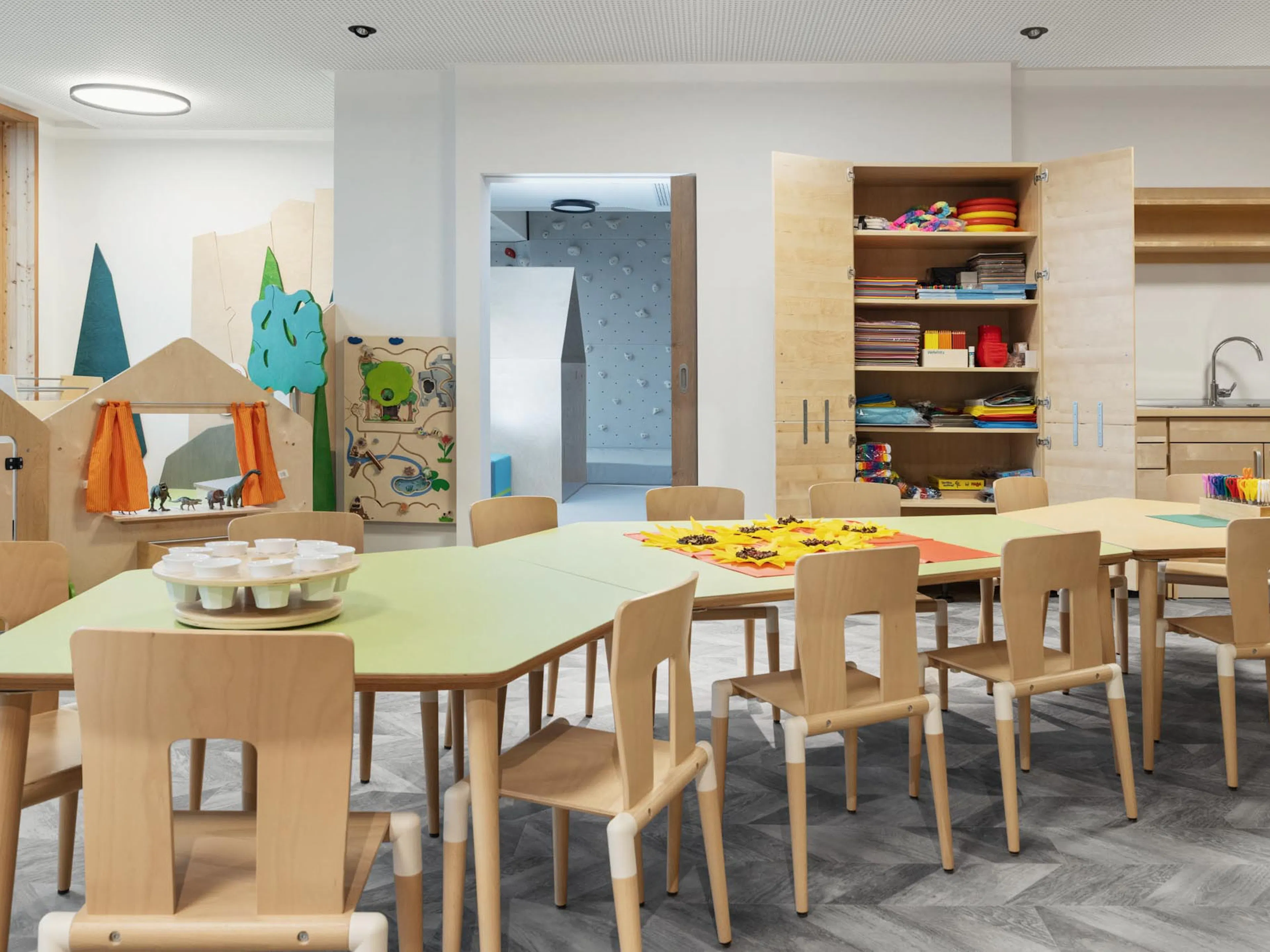 Mini Club with tables, chairs and arts and crafts supplies at The Grand Green – Familux Resort.