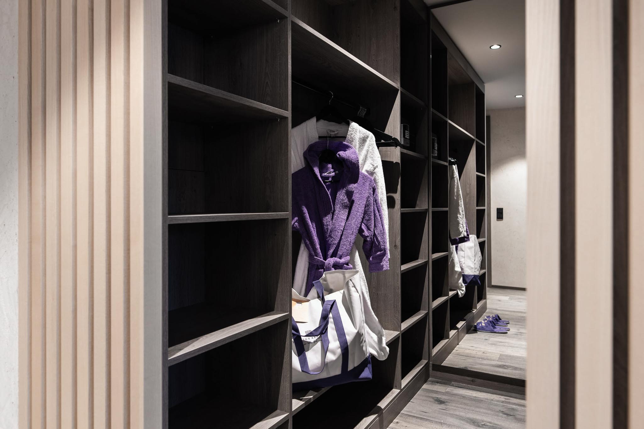 Wardrobe with bathrobe in a family suite at The Grand Green – Familux Resort.