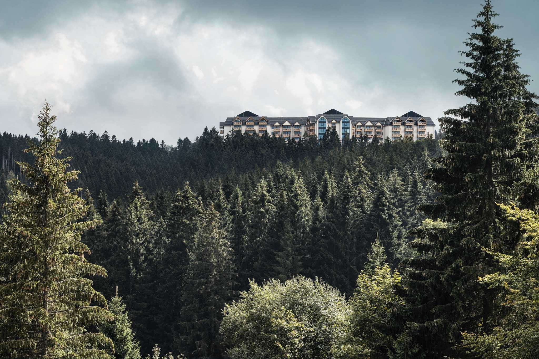 Aerial drone shot of The Grand Green – Familux Resort with the Thuringian Forest.