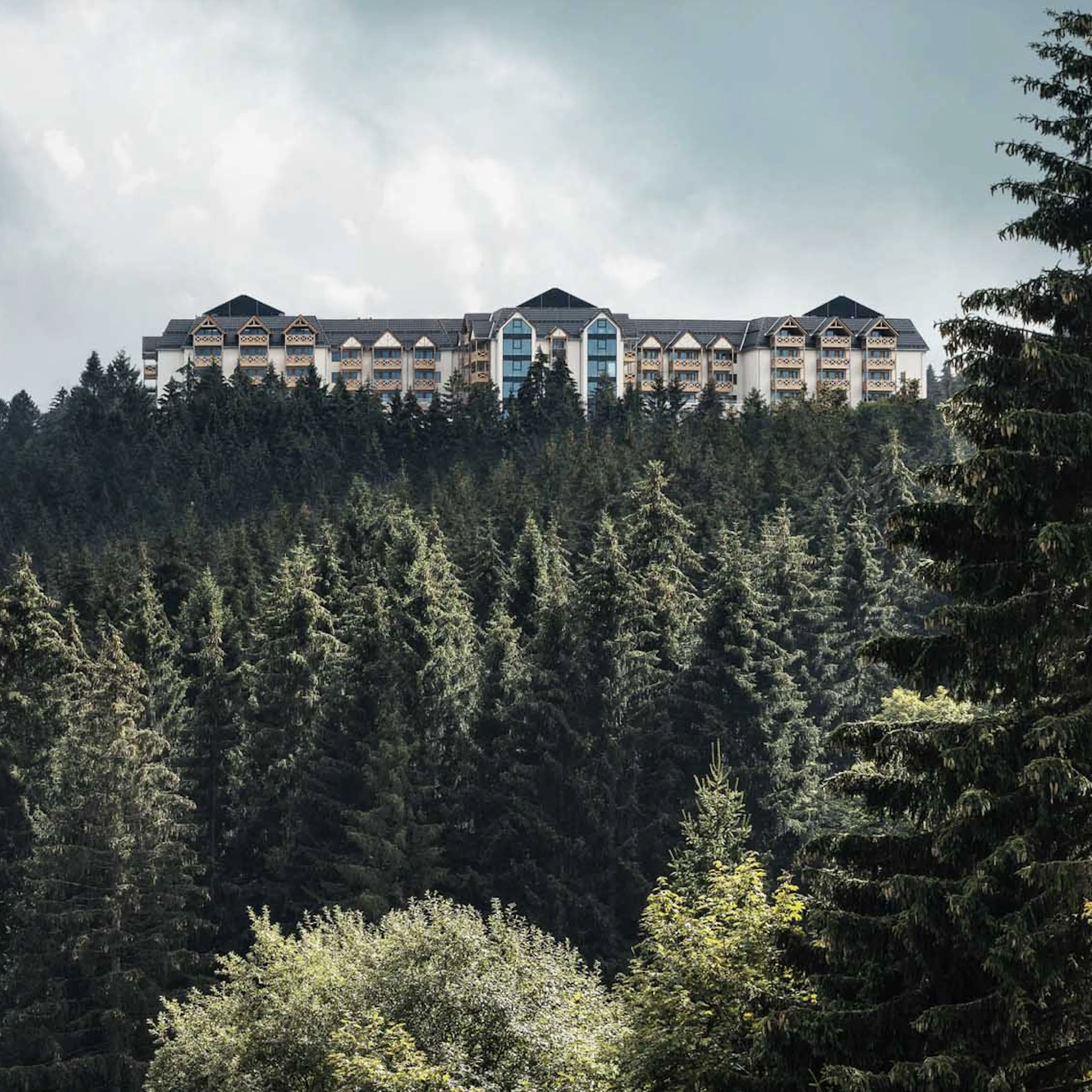 Aerial drone shot of The Grand Green – Familux Resort with the Thuringian Forest.