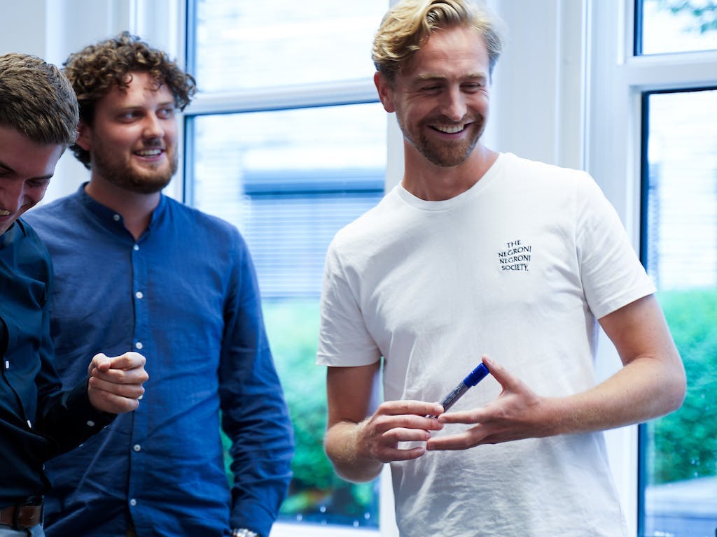 Drie lachende NextGenners tijdens een The.NextGen Masterminds Day.