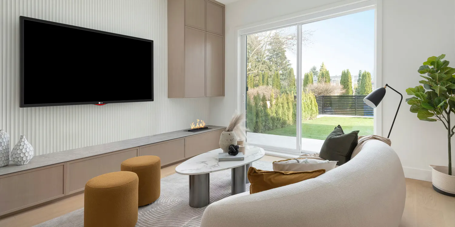 Modern living room with sliding doors to a backyard.