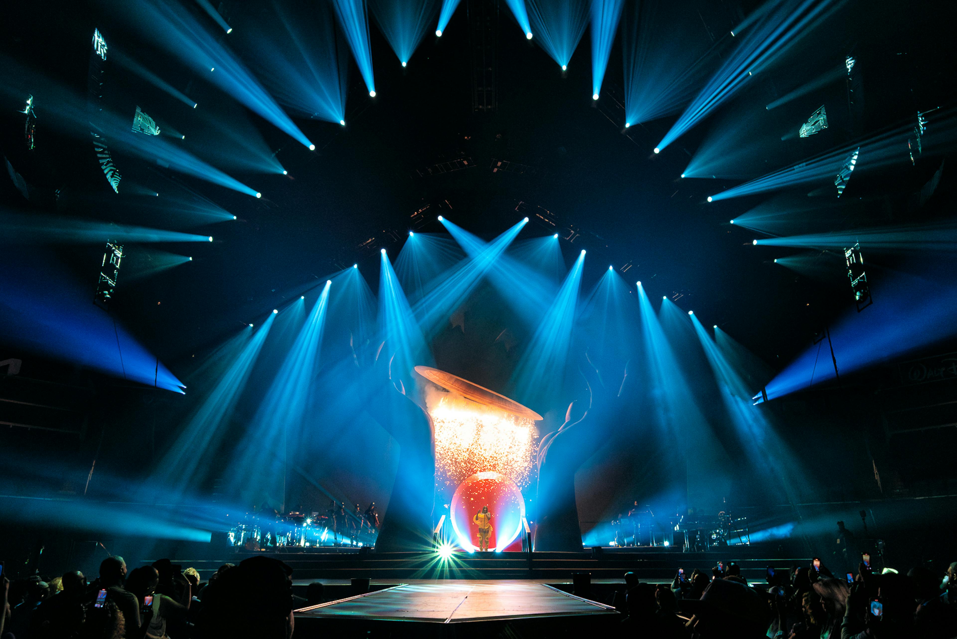 Mary J Blige performs under a waterfall of sparks