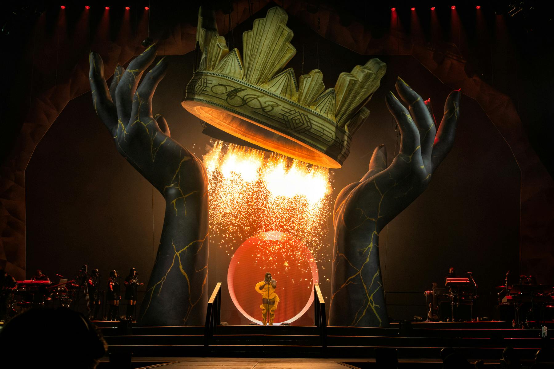 Mary J Blige performs under a waterfall of sparks