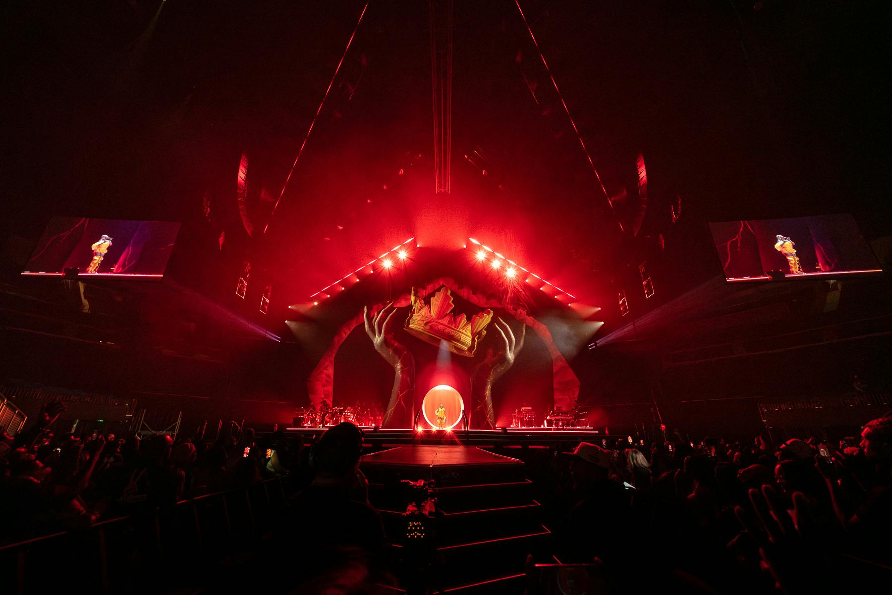 The stage is lit up in red light.