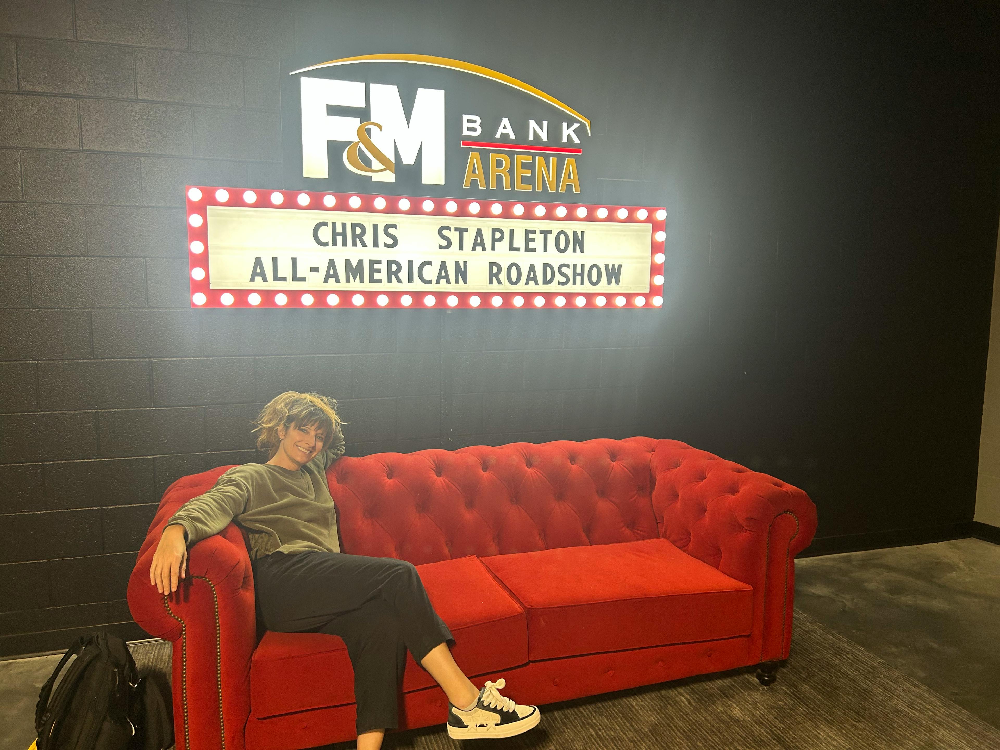 Sooner Sitting Under "Welcome" Sign