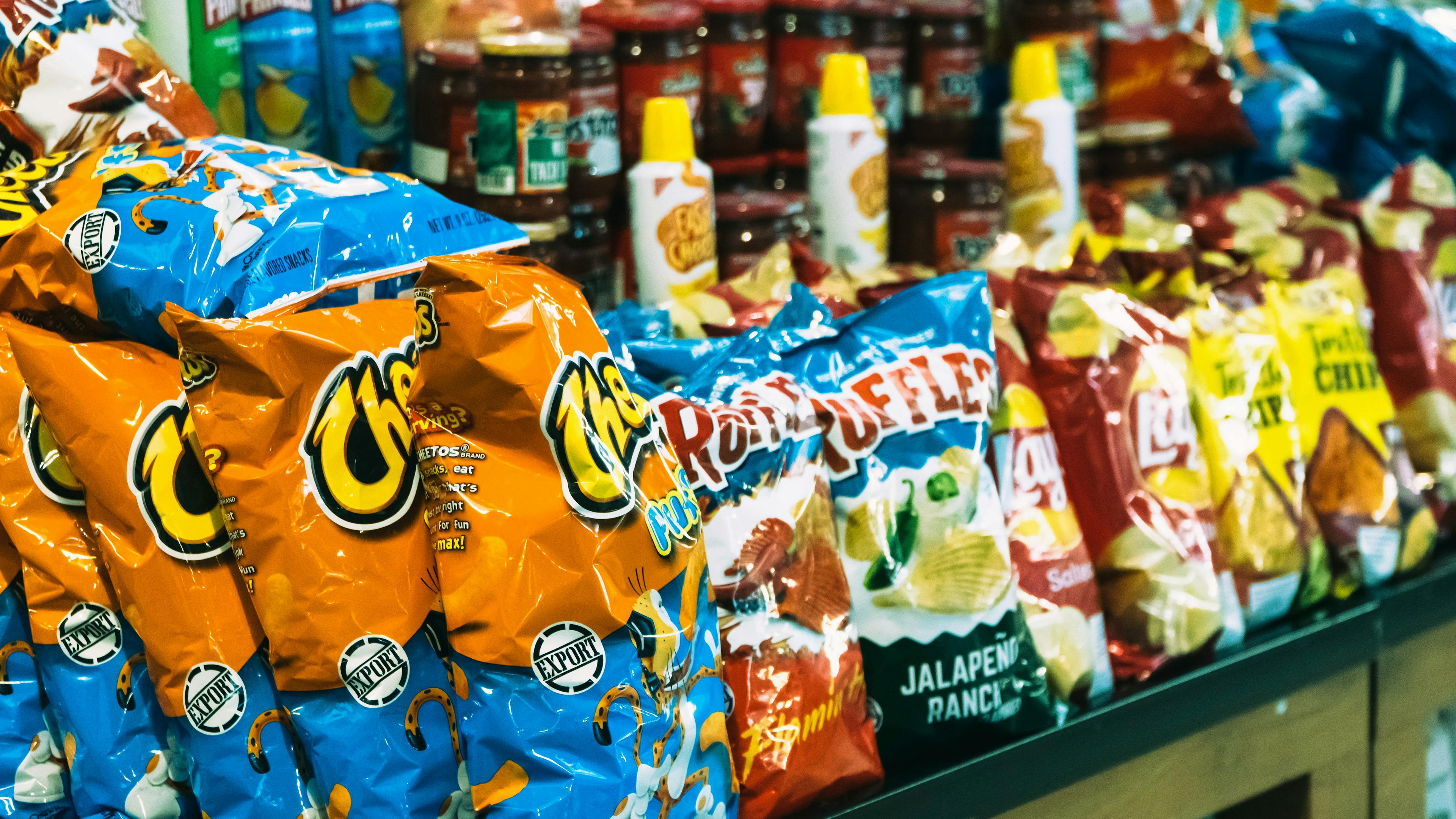 Unhealthy food in supermarket shelf