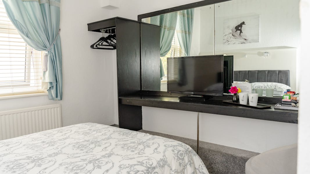 Budget room console table and bed