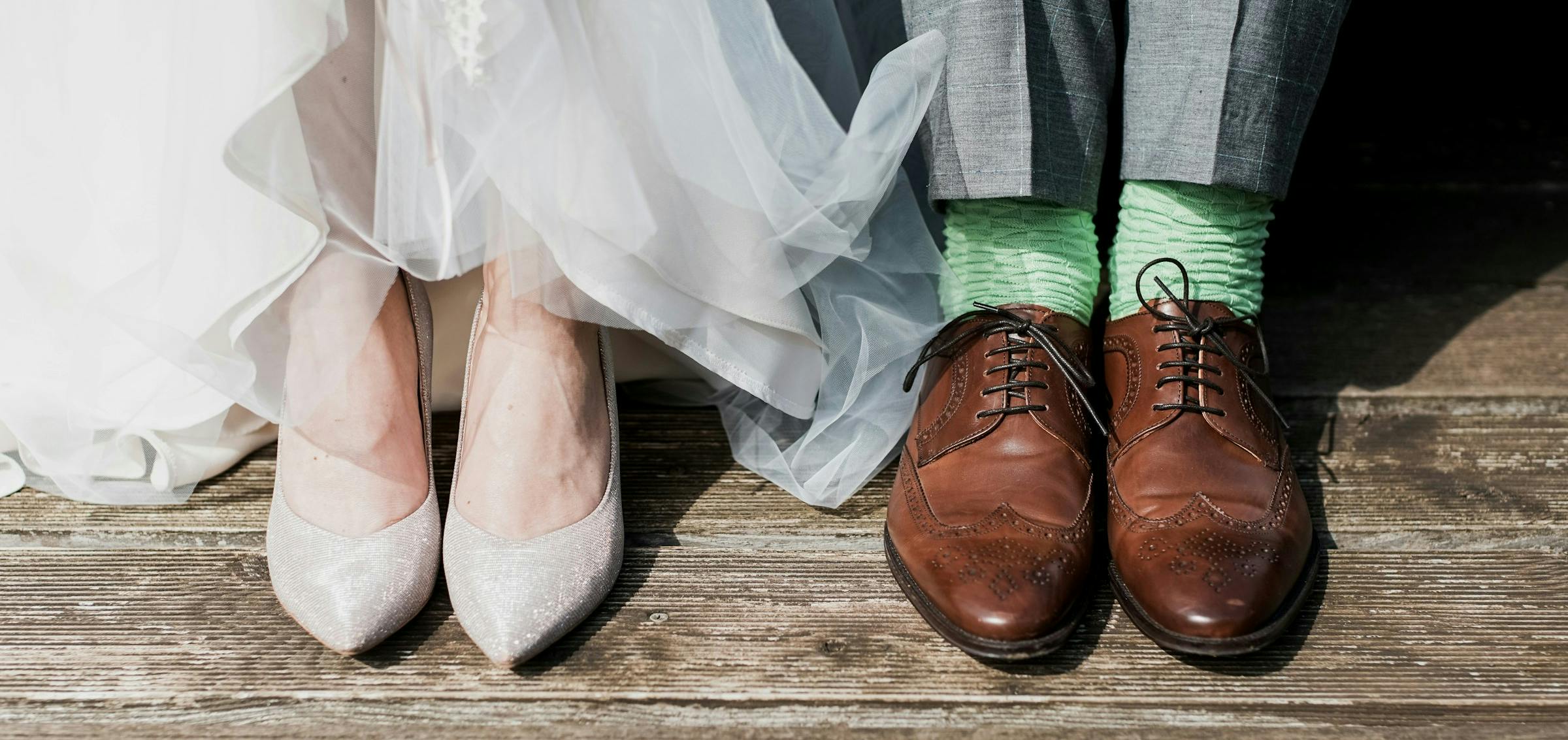 A bride and grooms wedding shoes