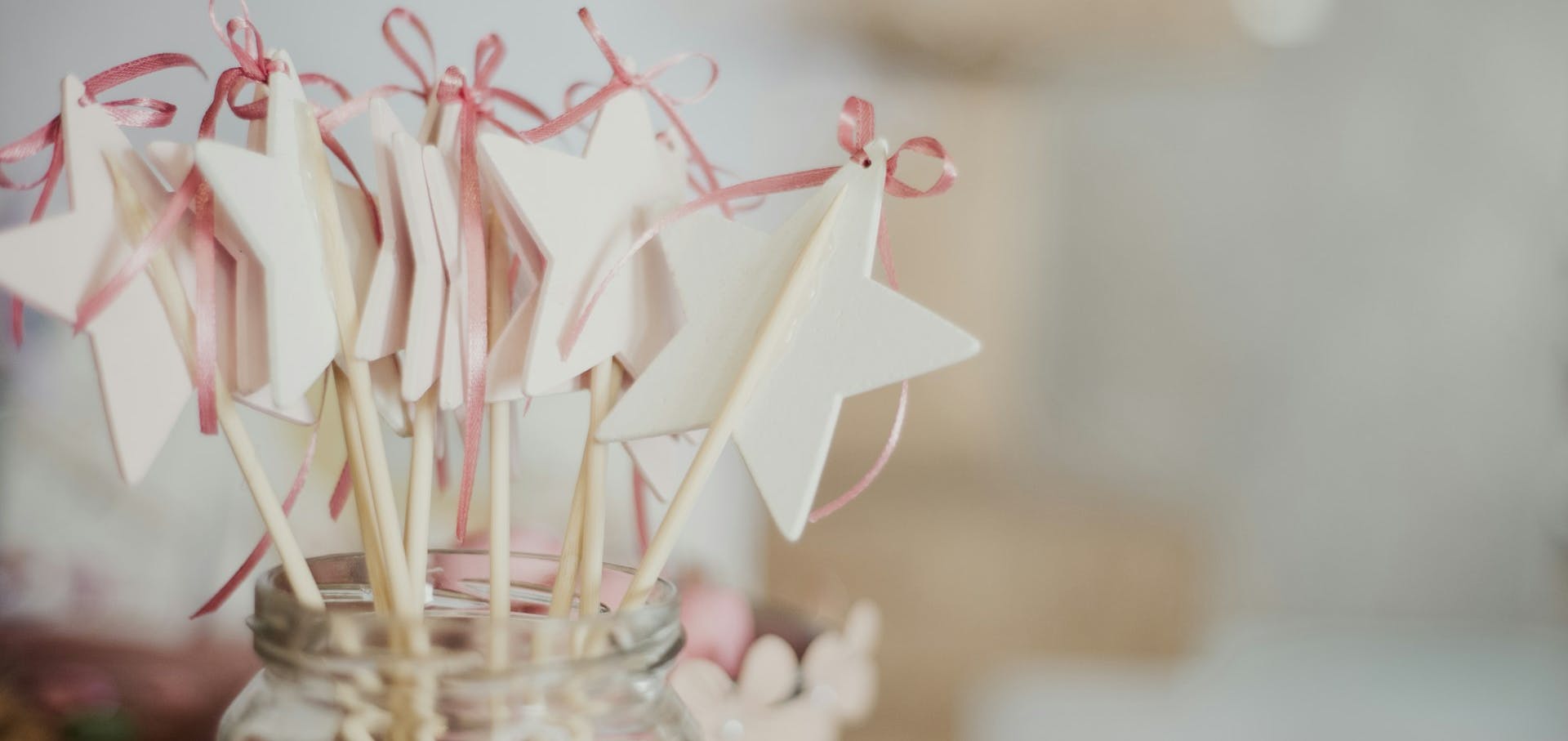 Christening decorations - paper stars in a glass jar