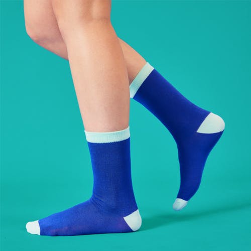 Woman wearing blue socks