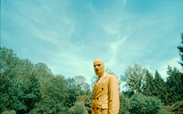 A yellow man in a forest