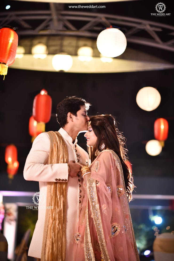 Forehead kiss couple pose