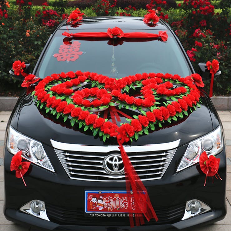 Car decoration for a wedding. Decorations on the car of the