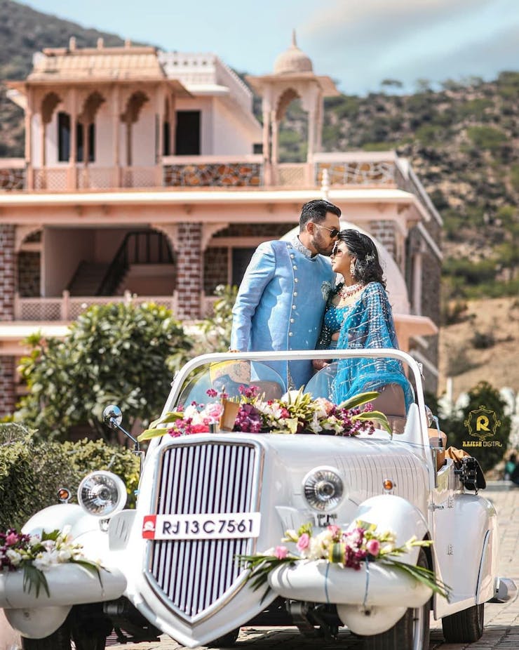 engagement couple entry in vintage car