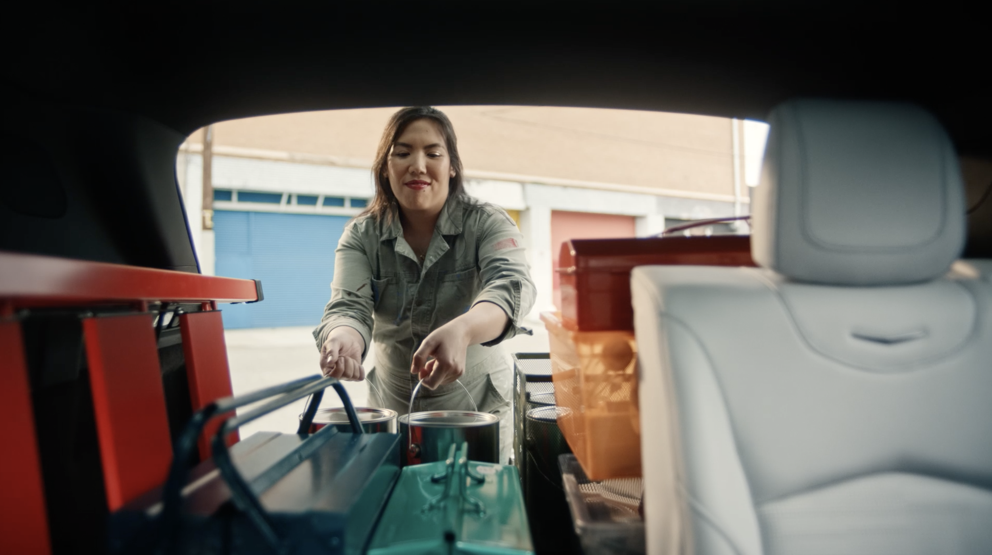 Artist loading paints into car