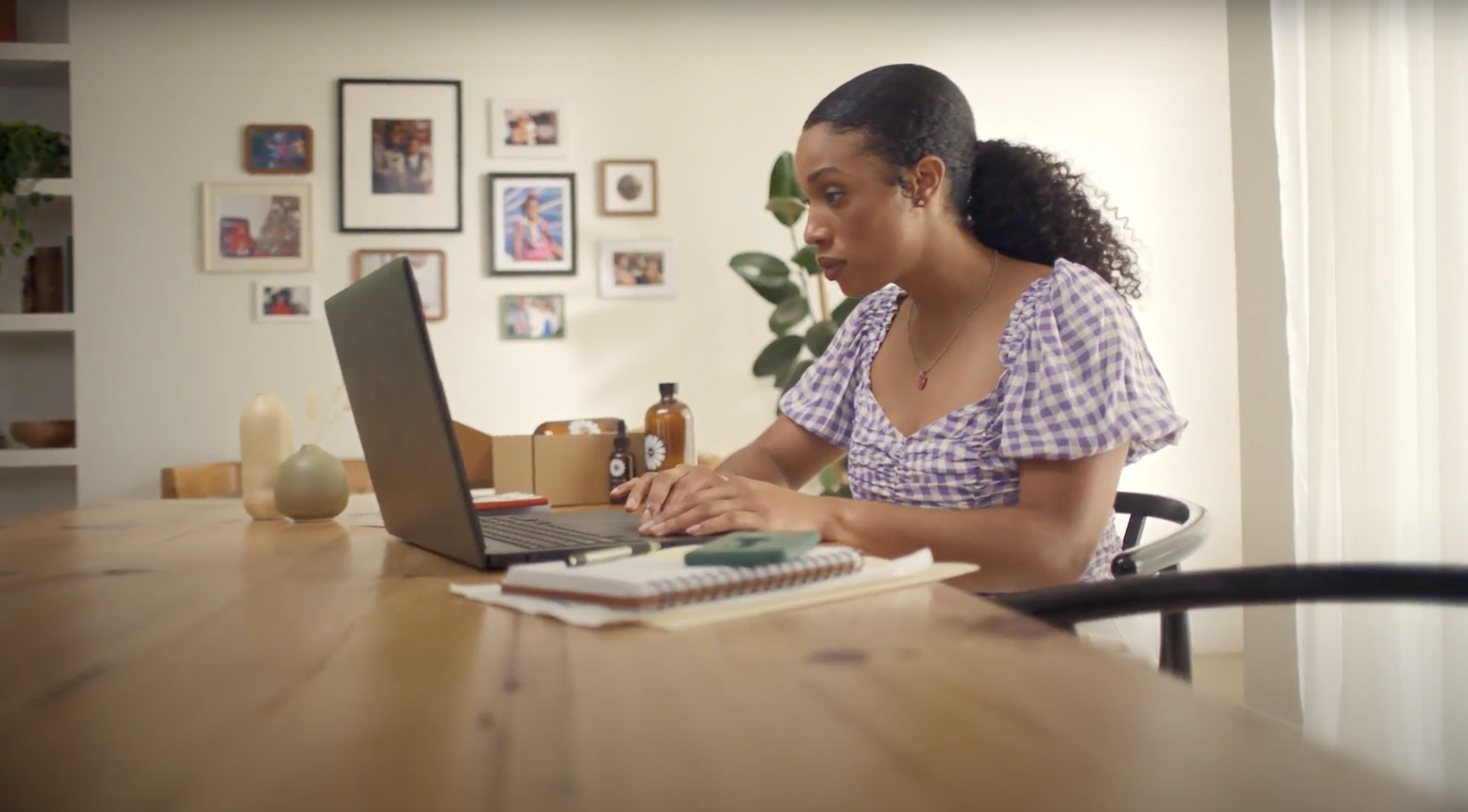 A woman works on a laptop
