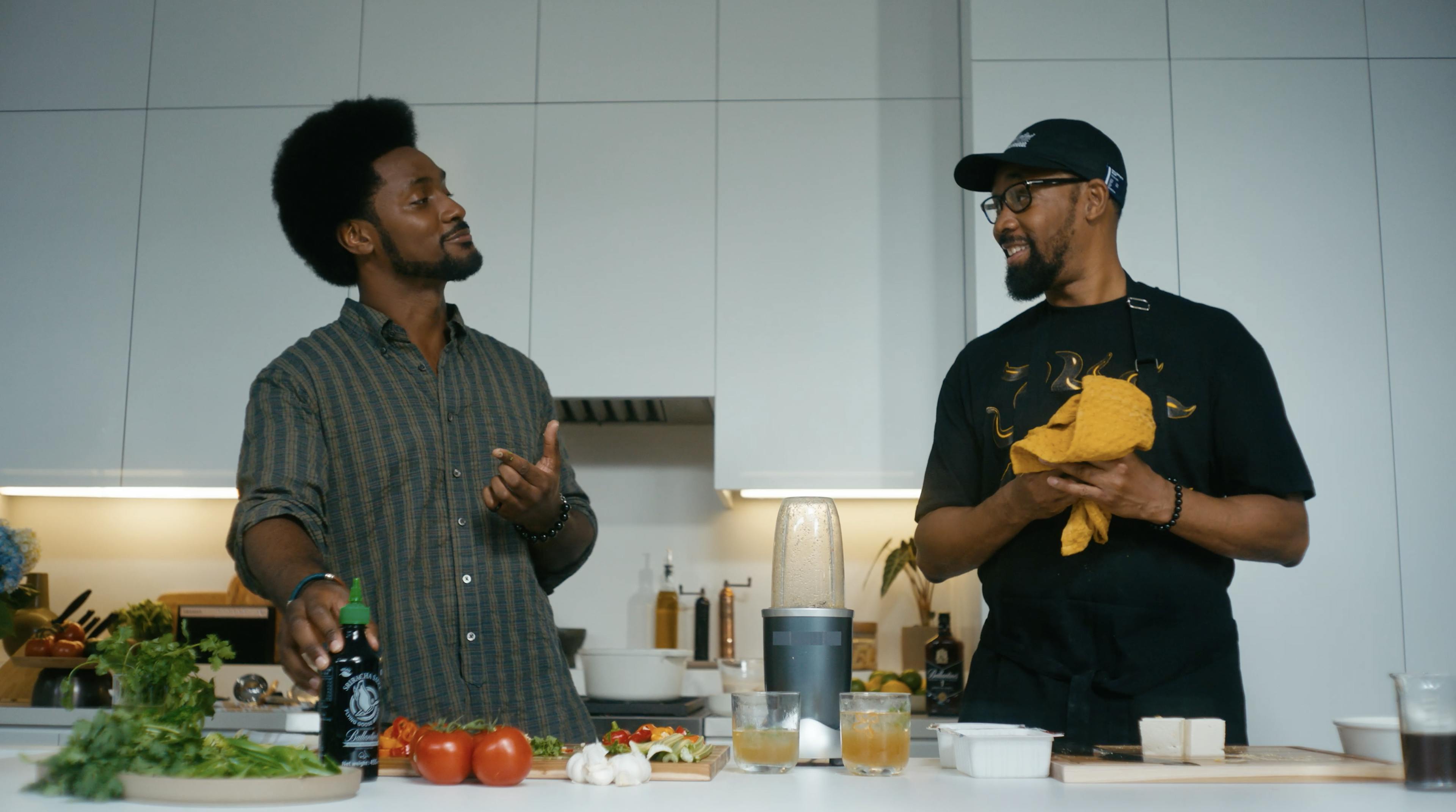 A man (RZA) and his son cook together with ingredients on the counter
