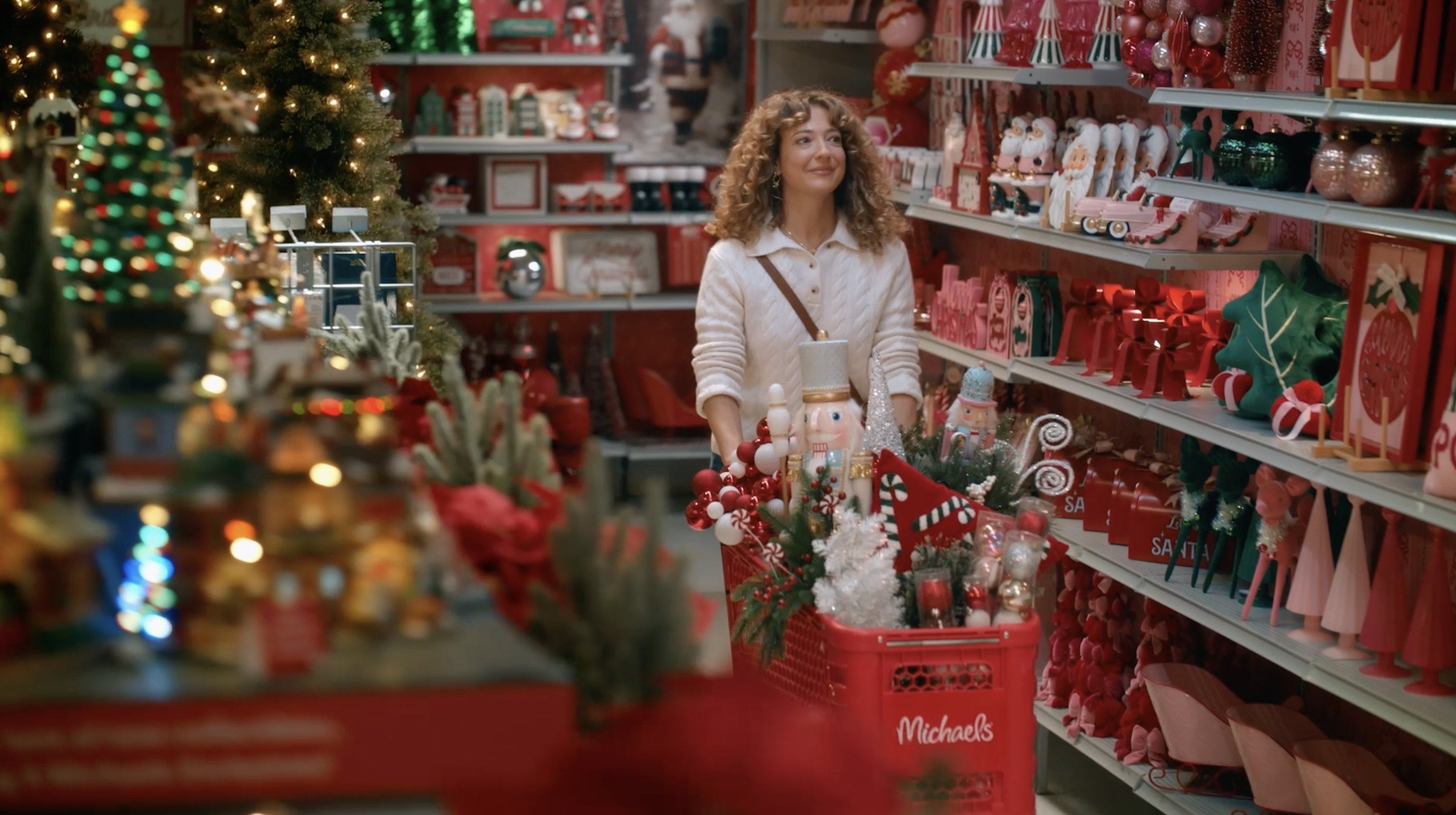 Woman with shopping cart in holidlay michaels store