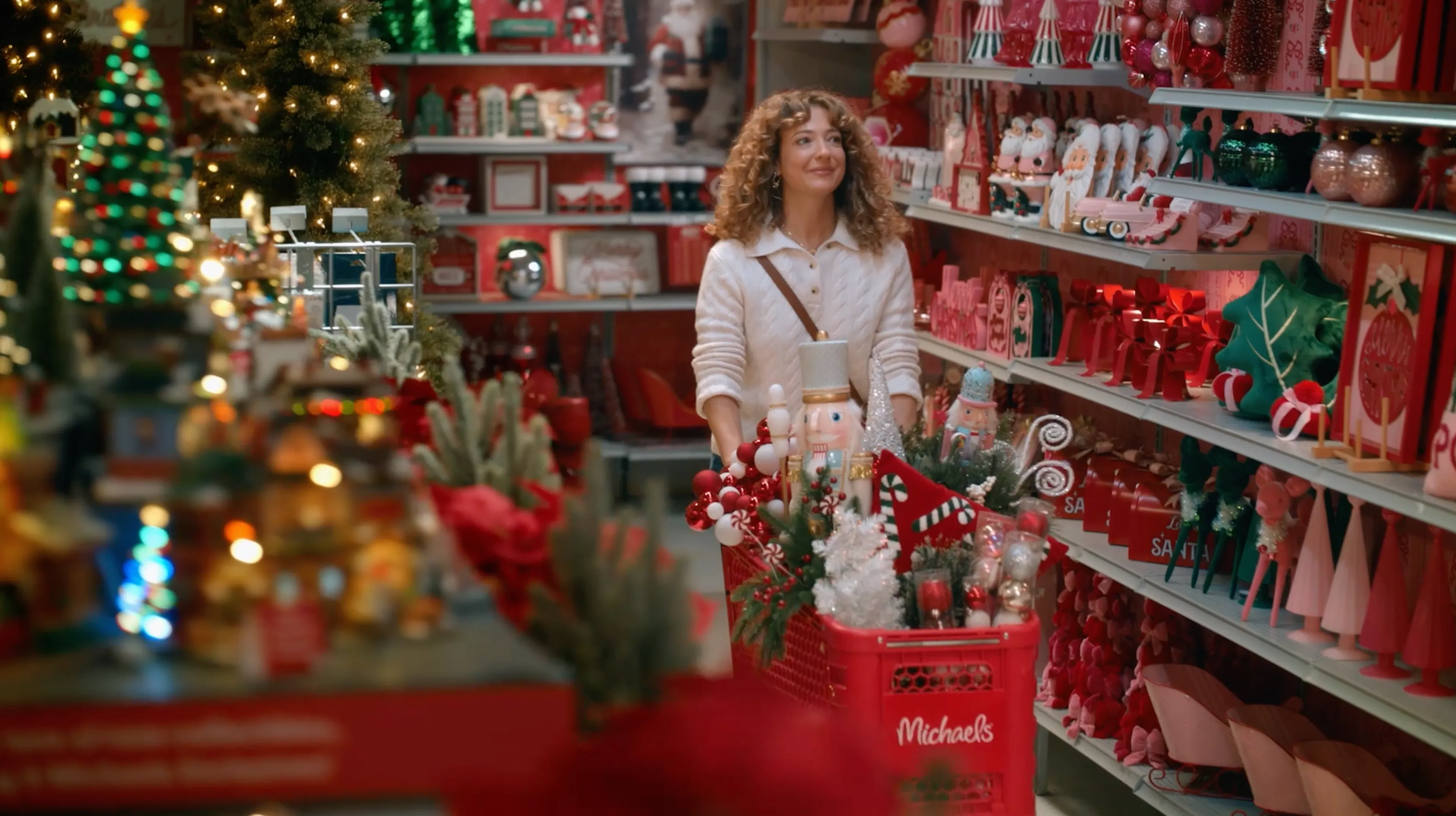 Woman with shopping cart in holidlay michaels store