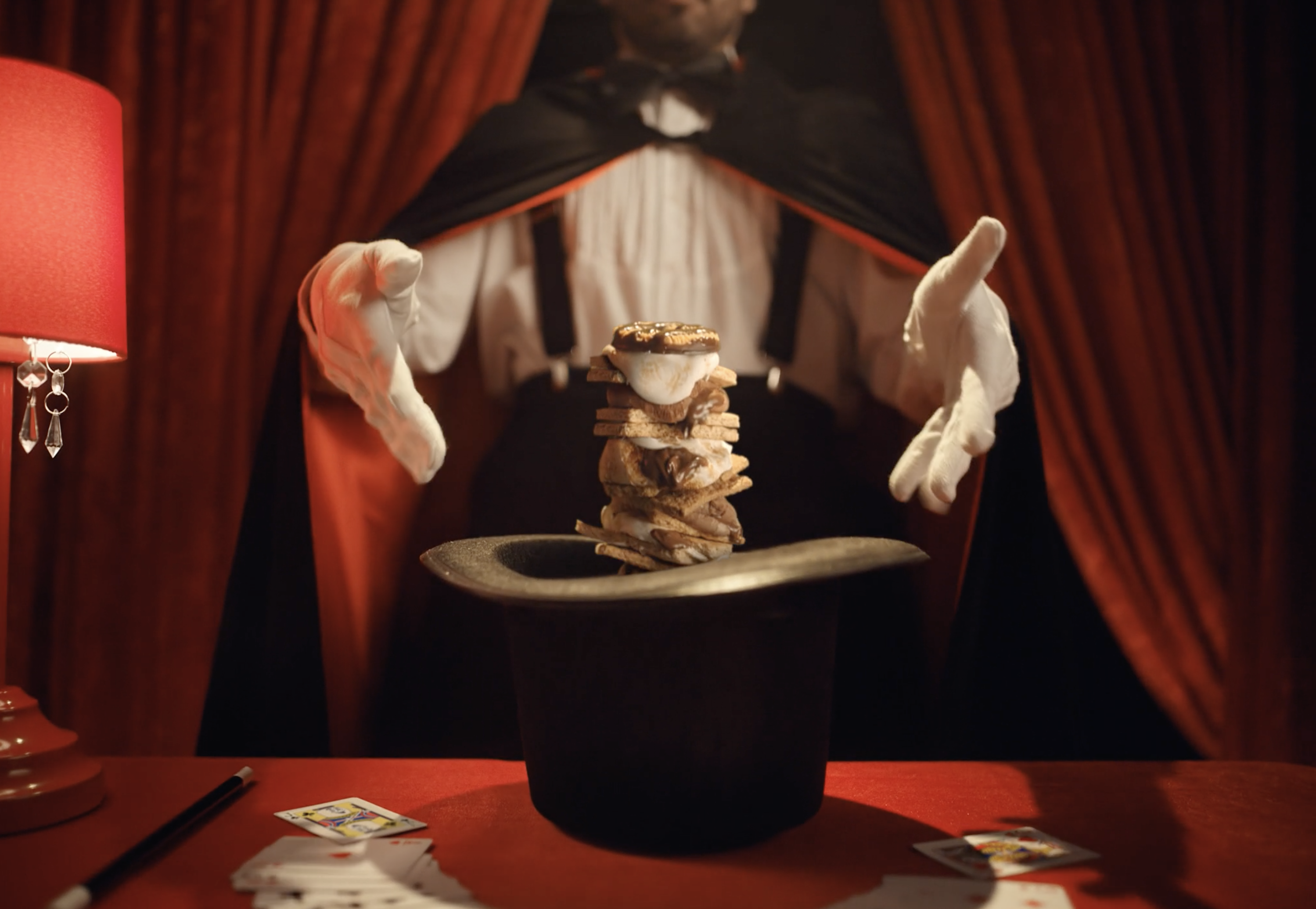 A magician pulls Stuffed Puffed smores out of a hat