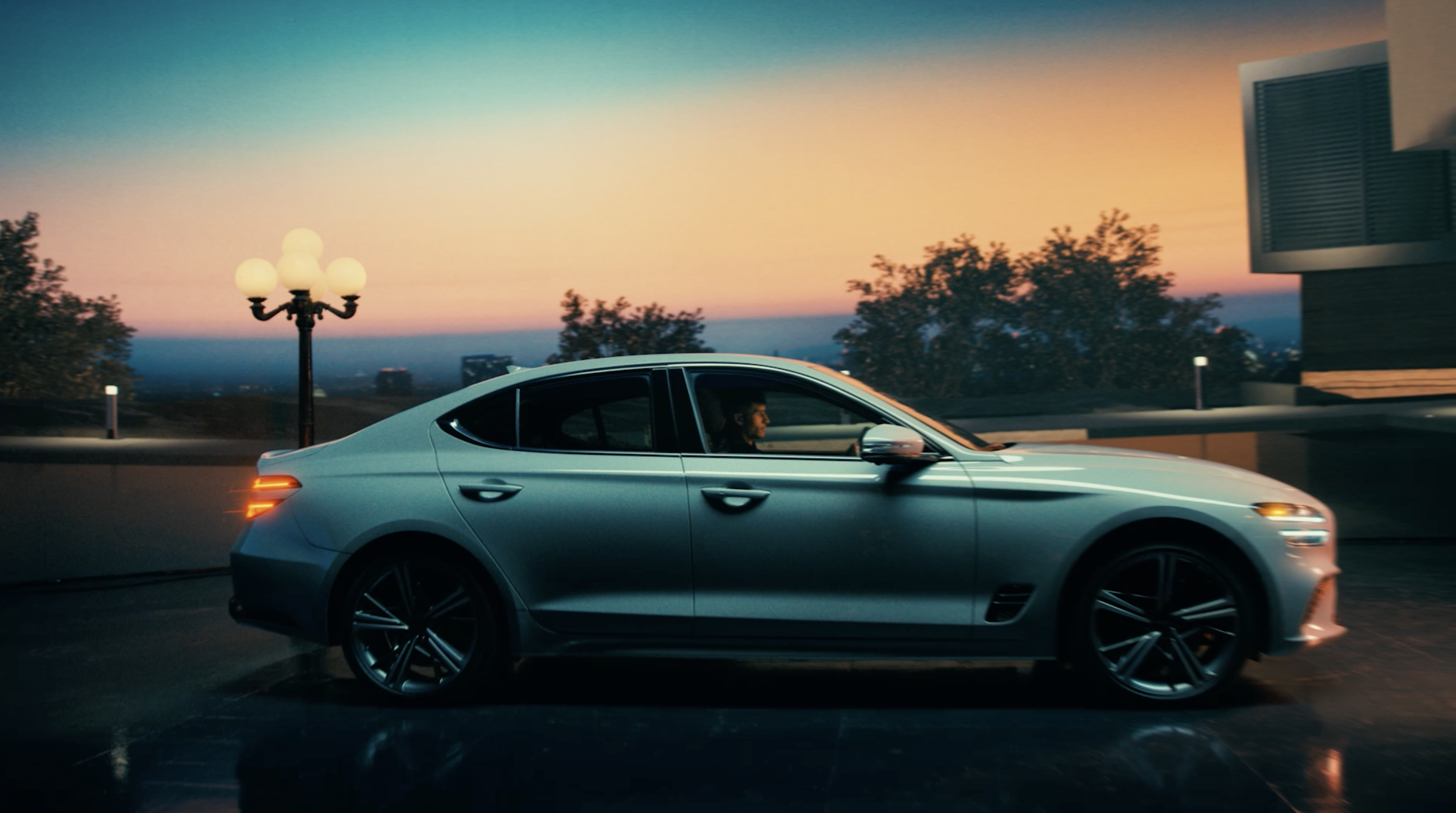 Genesis car parked outside a house at twilight