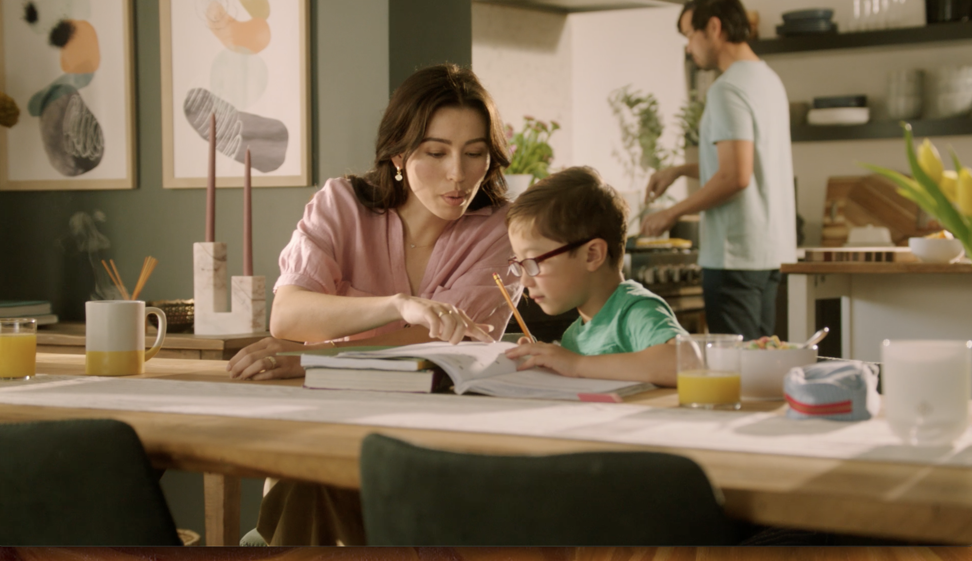 A woman goes over homework with her child