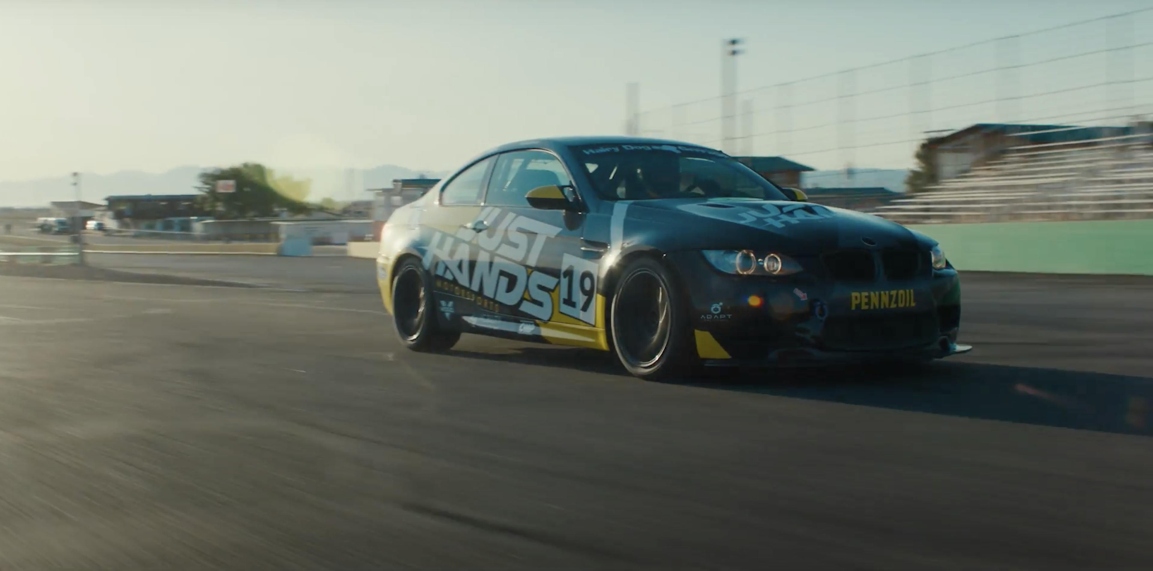 A racecar zooms down the track