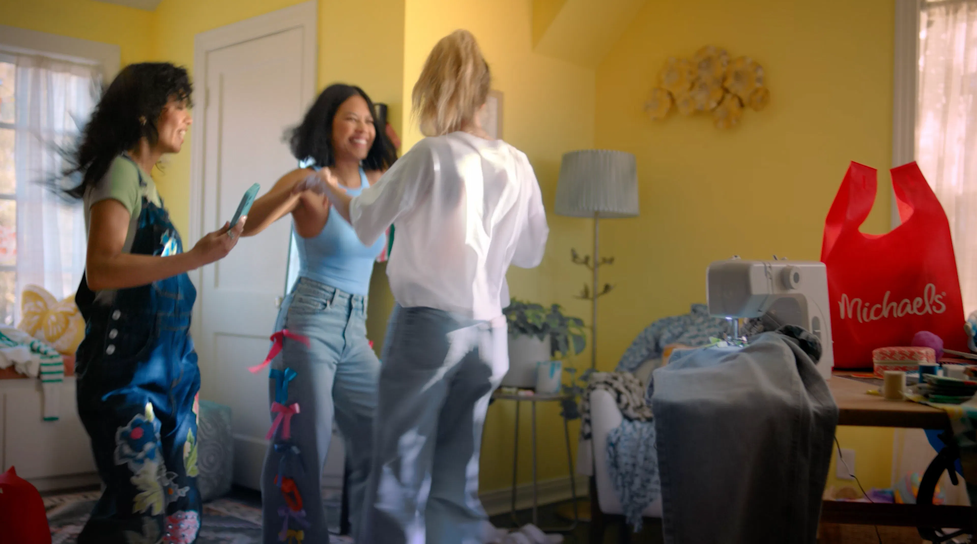 girls dancing in a yellow room