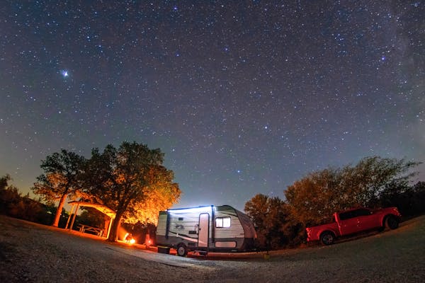Alison and Jason Takacs' Jayco Jay Flight parked at a campground under a starry night sky