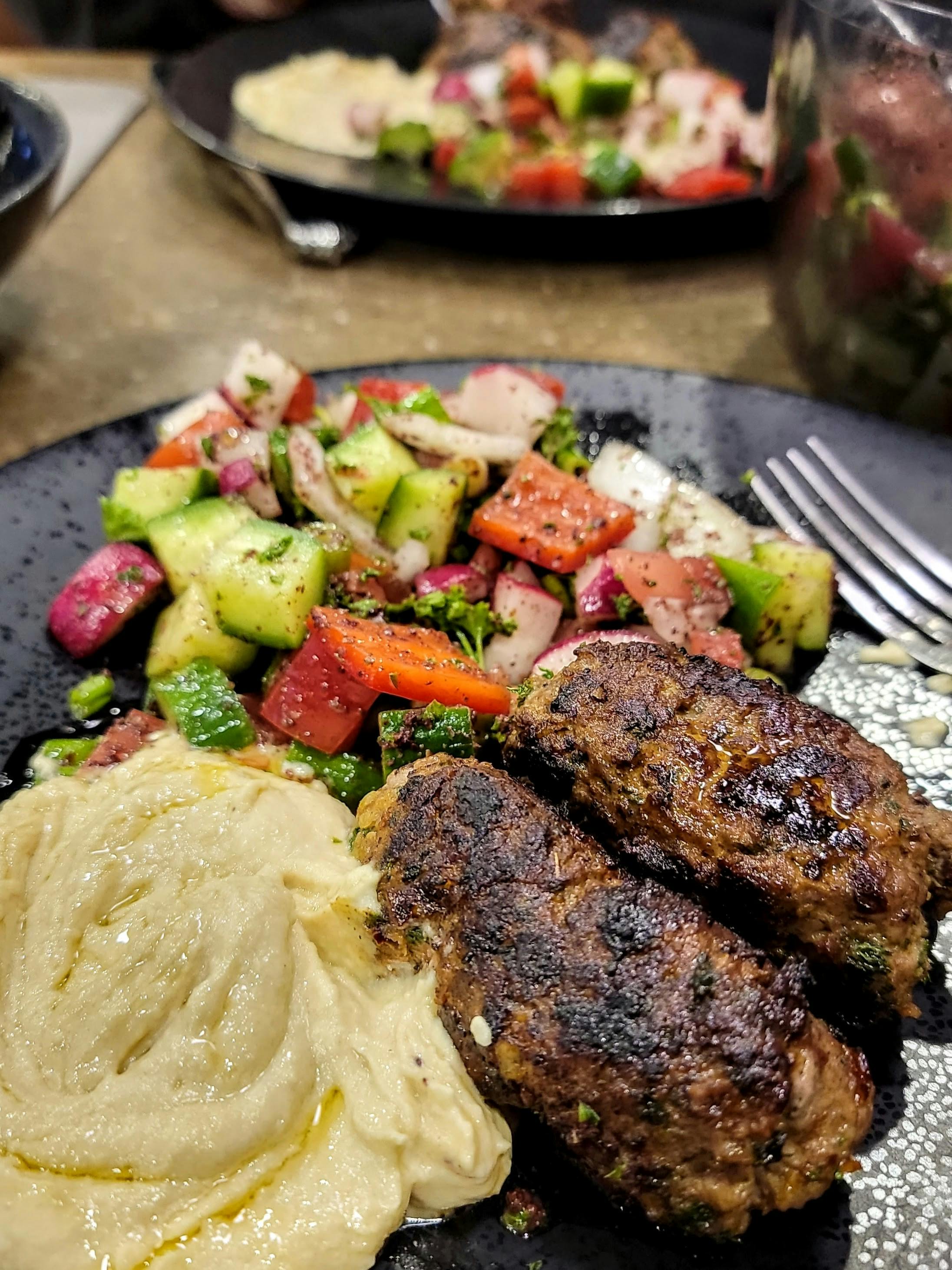 ANNE AND BRIAN KLUMPP's meal of kabobs, hummus and fattoush 
