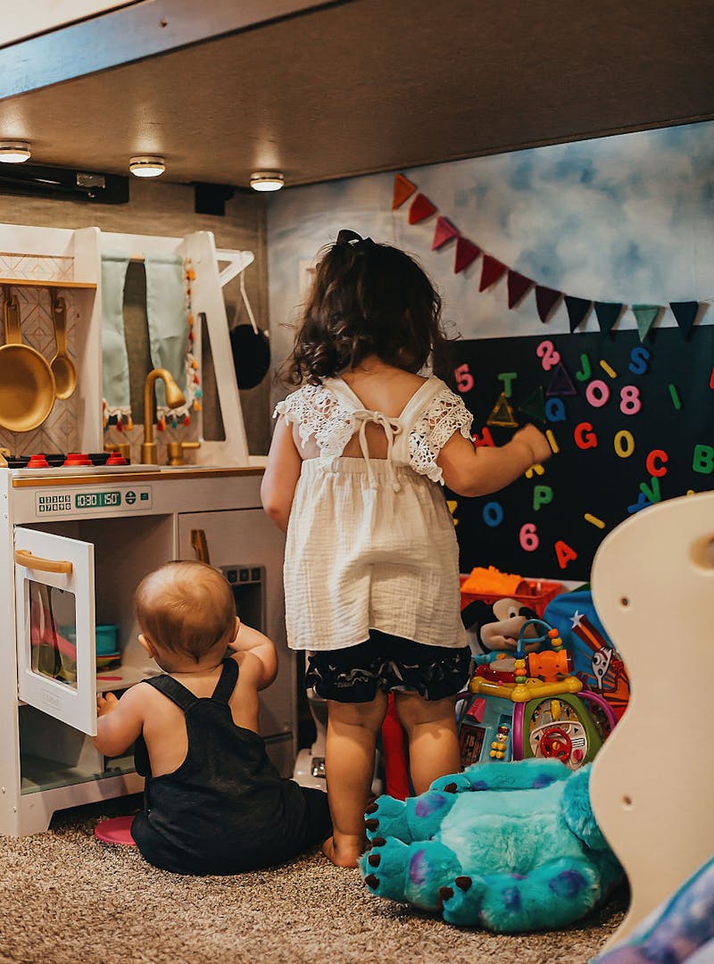 Sammy Seles' children play with their toys inside the family room of their Keystone Montana.
