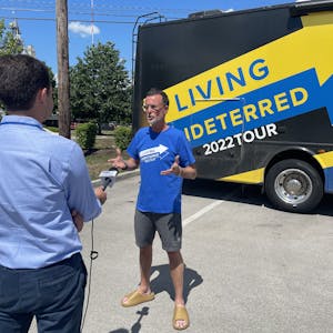 Jeff Johnston being interviewed in front of his Class A Motorhome