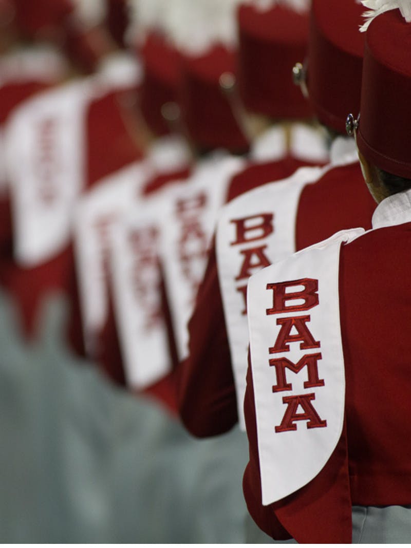 University of Alabama marching band, featuring Bama logo and crimson outfits from the back, in Tuscaloosa, Alabama.