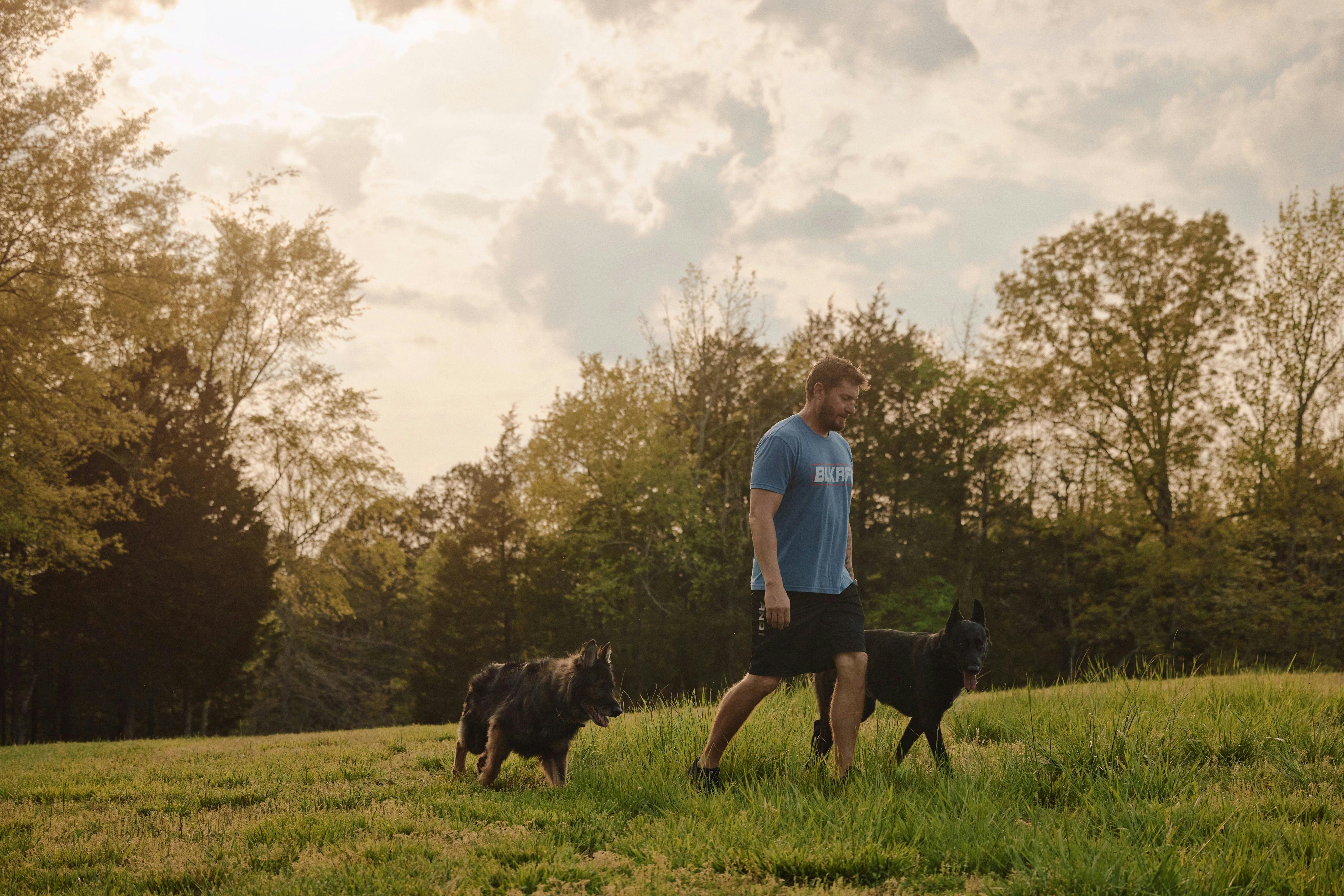 Aaron Tucker walking with his dogs