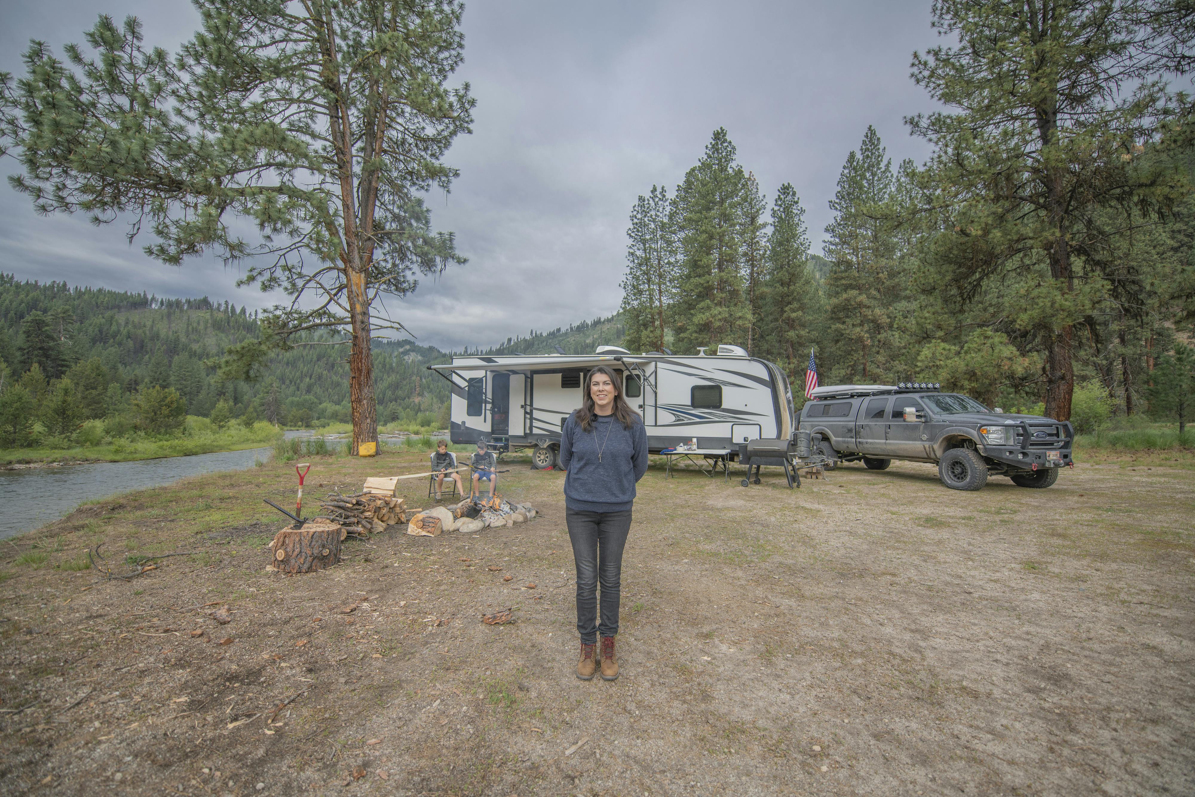 Chelsea Day standing in front of her boondocking camping location