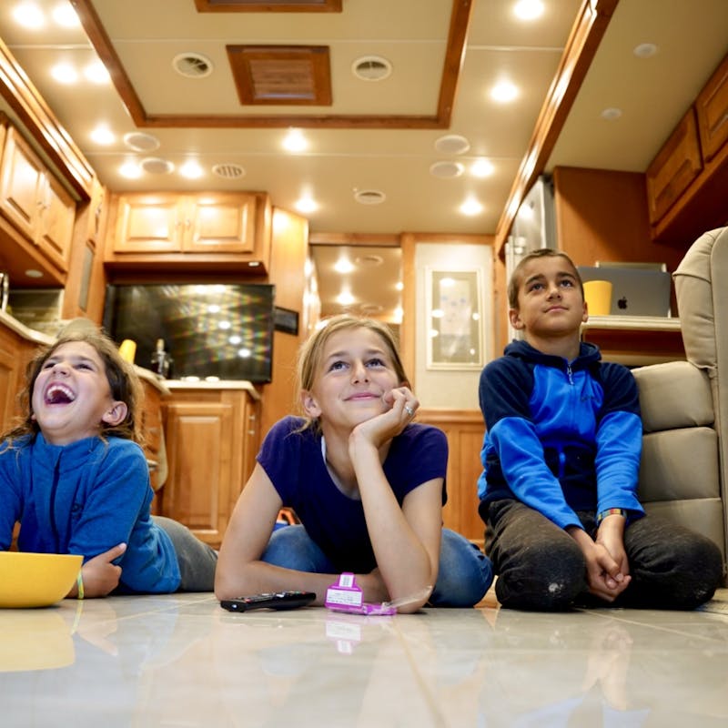 Laura Georgieff's three children relaxing inside their Tiffin Phaeton