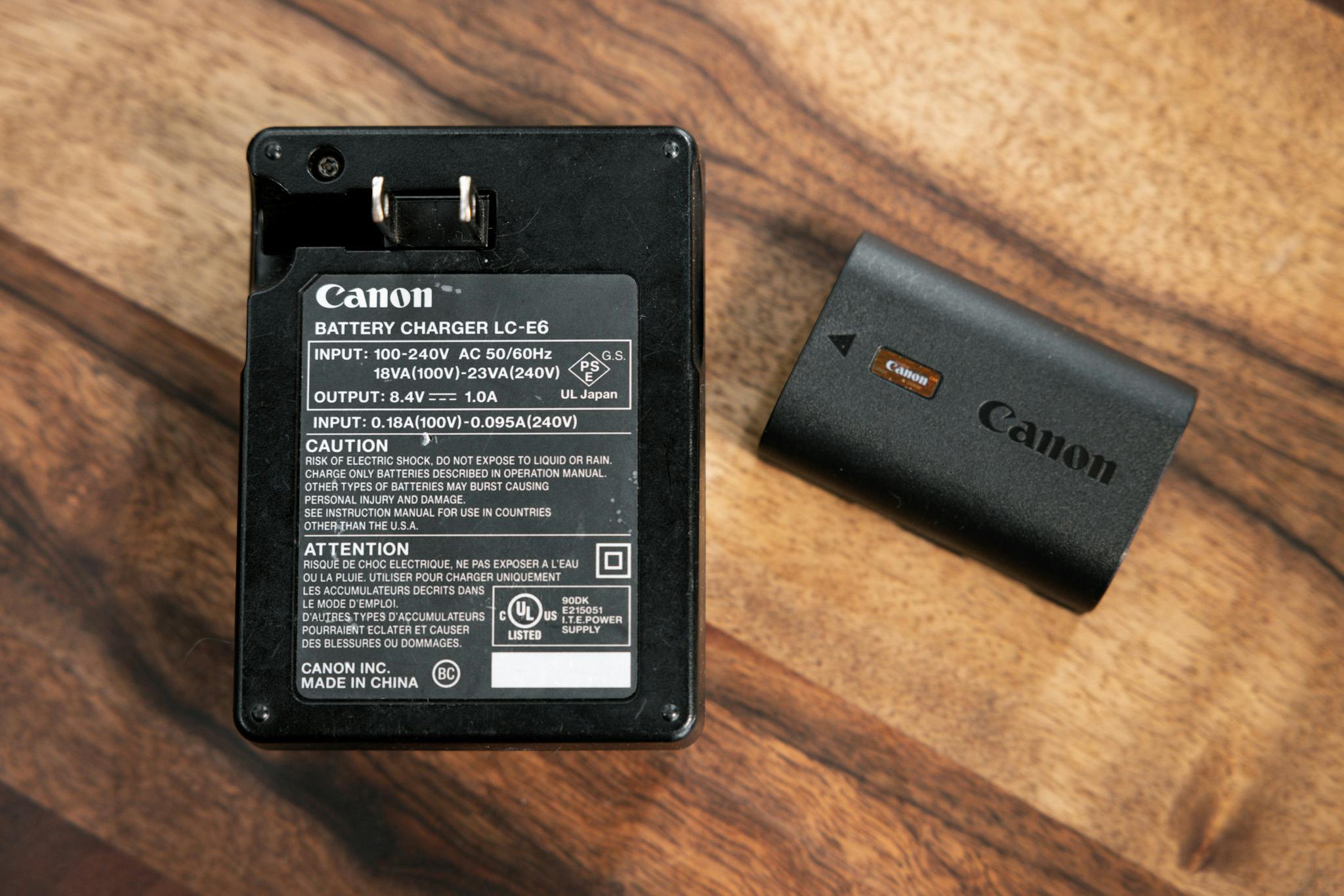A Canon battery pack and charger